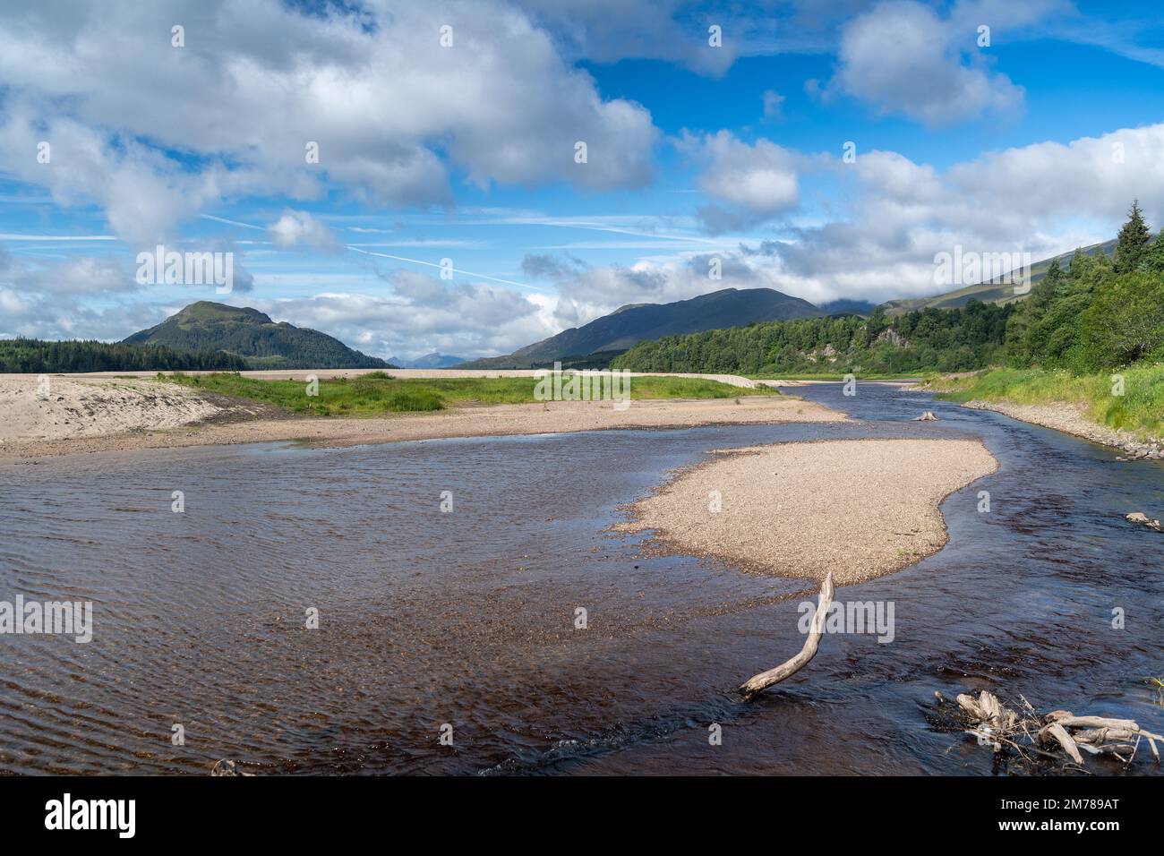 River Pattack as it enters Loch Laggan in the Highlands, looking towards Ben Nevis and Fort William, Scottish Highlands, UK. Stock Photo