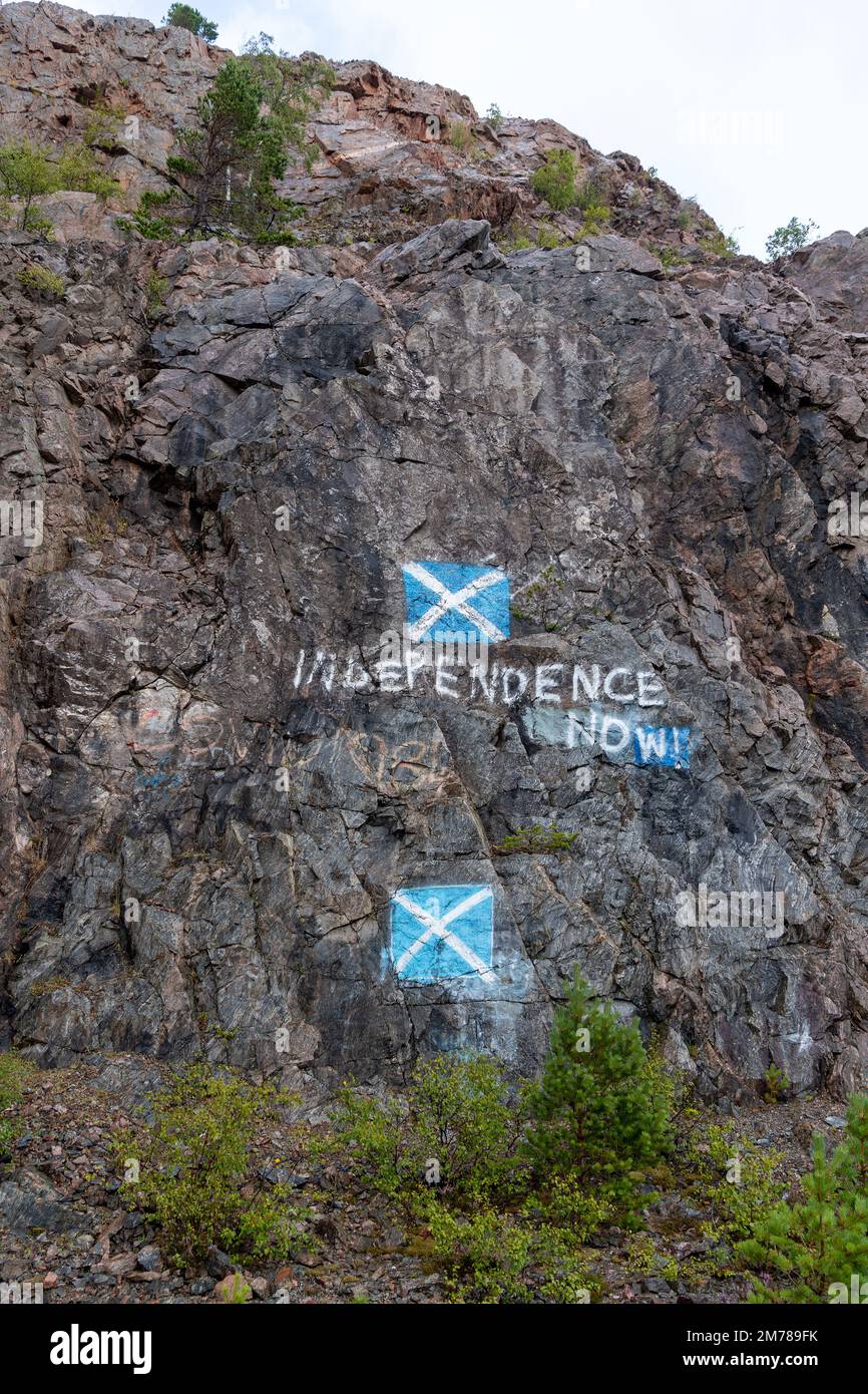 Scottish Independence protest painted onto a rock face alongside the A9 in the Highlands of Scotland, UK. Stock Photo