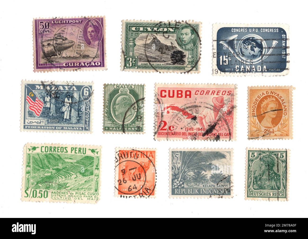 Vintage used postage stamps from around the world isolated on a white