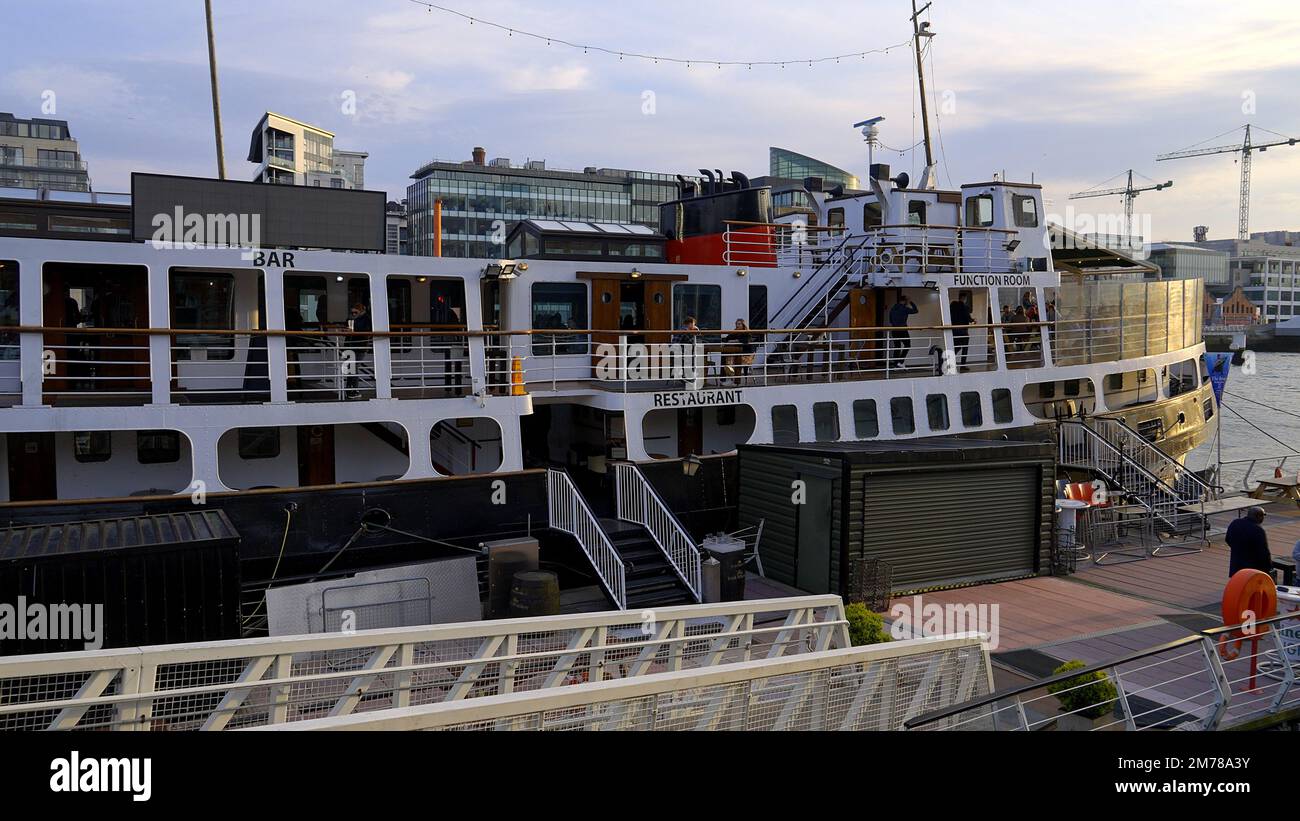 Party and Restaurant Boat on River Liffey in Dublin - DUBLIN, IRELAND - APRIL 20, 2022 Stock Photo