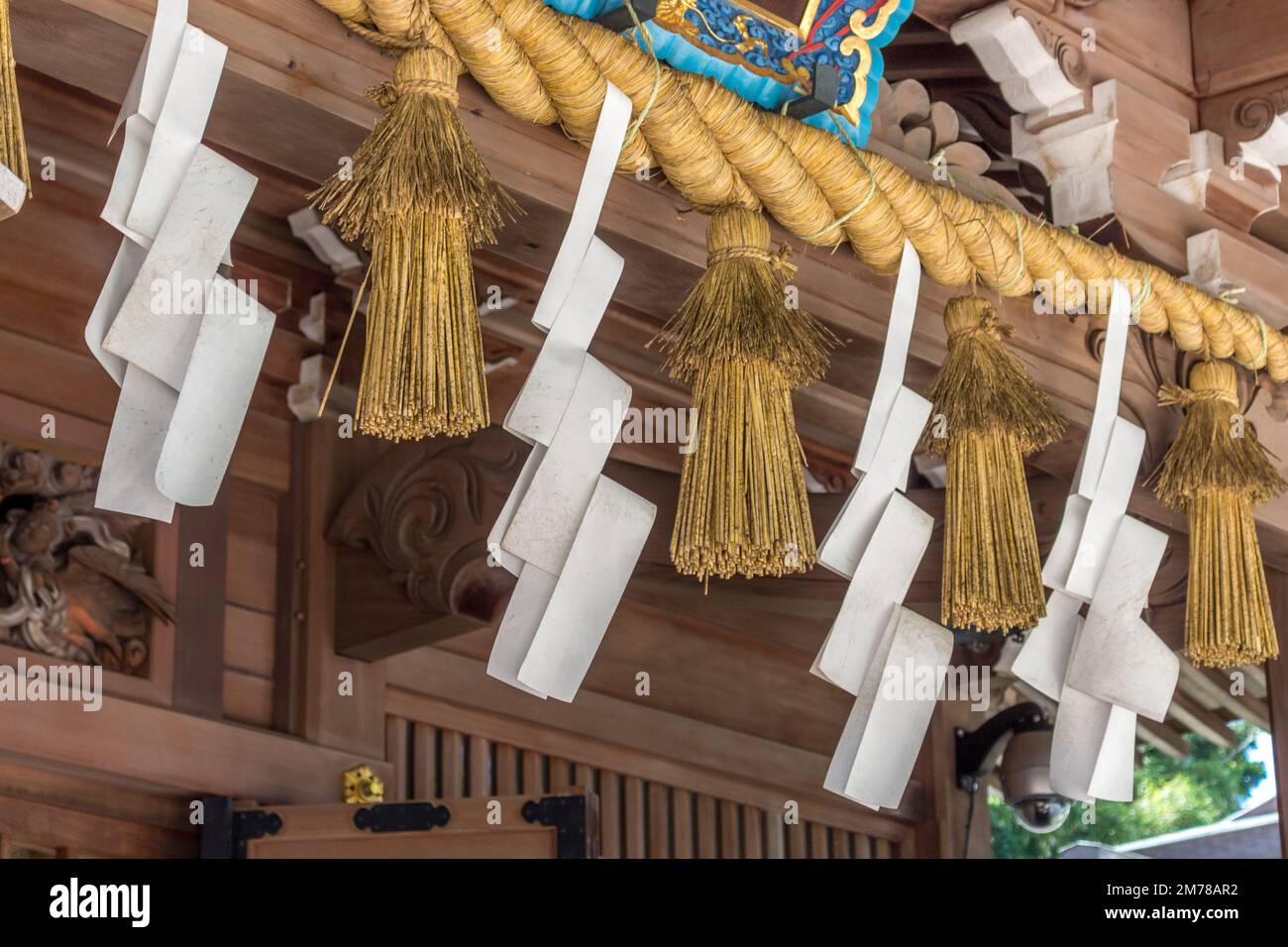 Shimenawa rope and zigzag paper decorations (shide) at Enoshima shinto