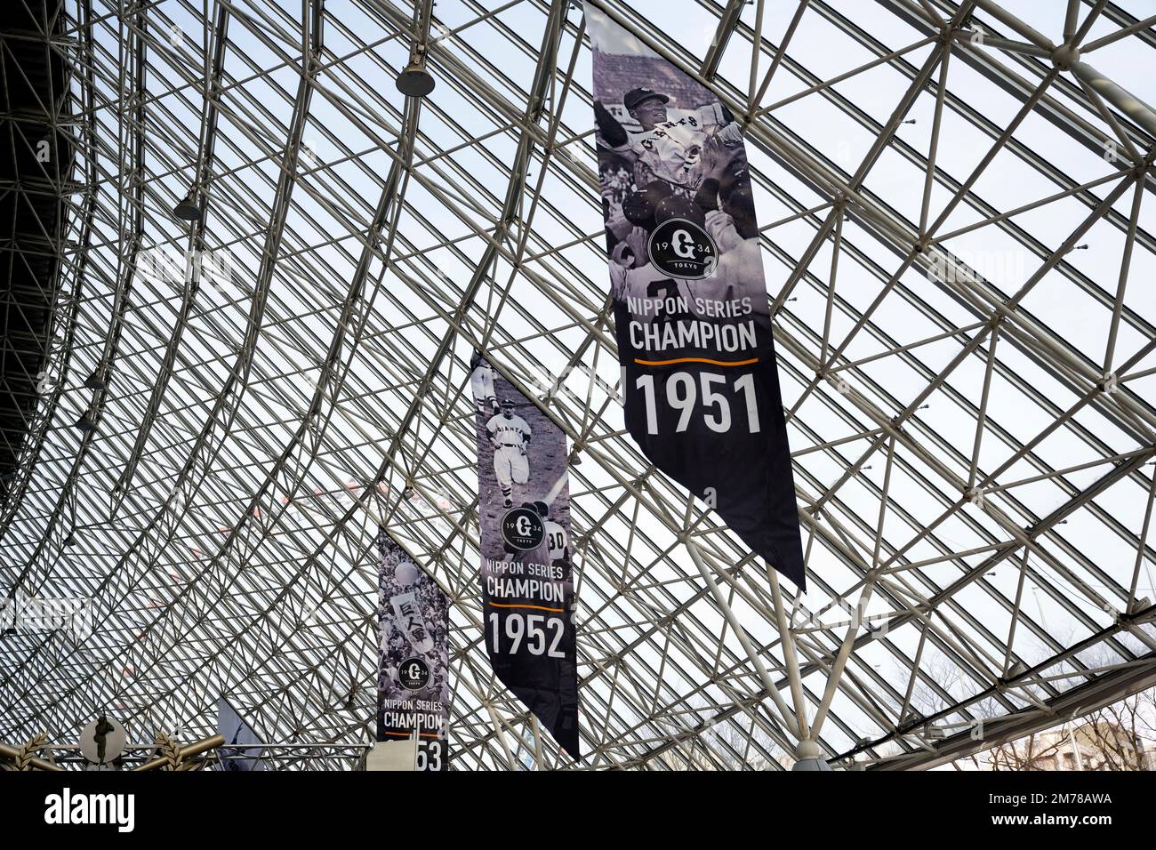 Tokyo, Japan. 6th Jan, 2023. Banners of Nippon Championships won by the Yomiuri Giants at the Tokyo Dome on an off-season day.The Tokyo Dome is a multi-purpose stadium dome roofed indoor stadium. It was completed in 1988 and has a capacity of 55,000 people. The dome has a retractable roof, making it suitable for hosting both indoor and outdoor events. It is the home of the Yomiuri Giants, a professional baseball team in the Nippon Professional Baseball, and is also used for concerts, exhibitions, and other sporting events. It is a popular tourist attraction and offers a variety of ameniti Stock Photo