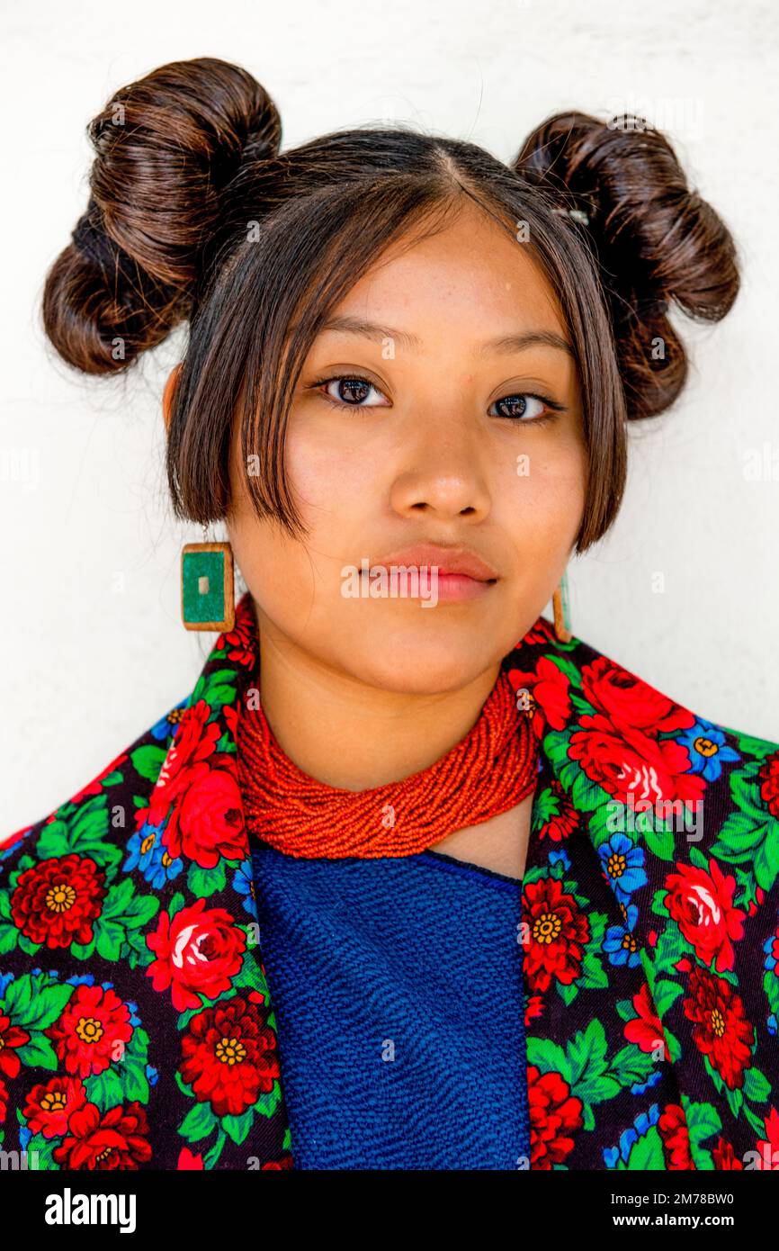 Faces of the World: Young Hopi Woman with traditional Squash Blossom Whorl Stock Photo
