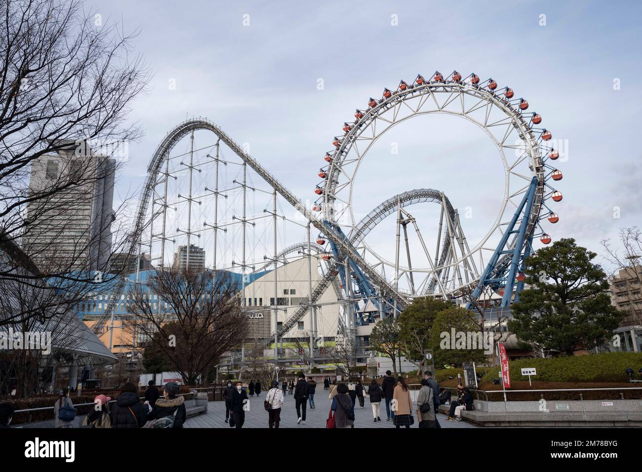 Tokyo, Japan. 6th Jan, 2023. Rollercoasters at the Tokyo Dome City amusement park.The Tokyo Dome is a multi-purpose stadium dome roofed indoor stadium. It was completed in 1988 and has a capacity of 55,000 people. The dome has a retractable roof, making it suitable for hosting both indoor and outdoor events. It is the home of the Yomiuri Giants, a professional baseball team in the Nippon Professional Baseball, and is also used for concerts, exhibitions, and other sporting events. It is a popular tourist attraction and offers a variety of amenities in Tokyo Dome City, including restaurants Stock Photo