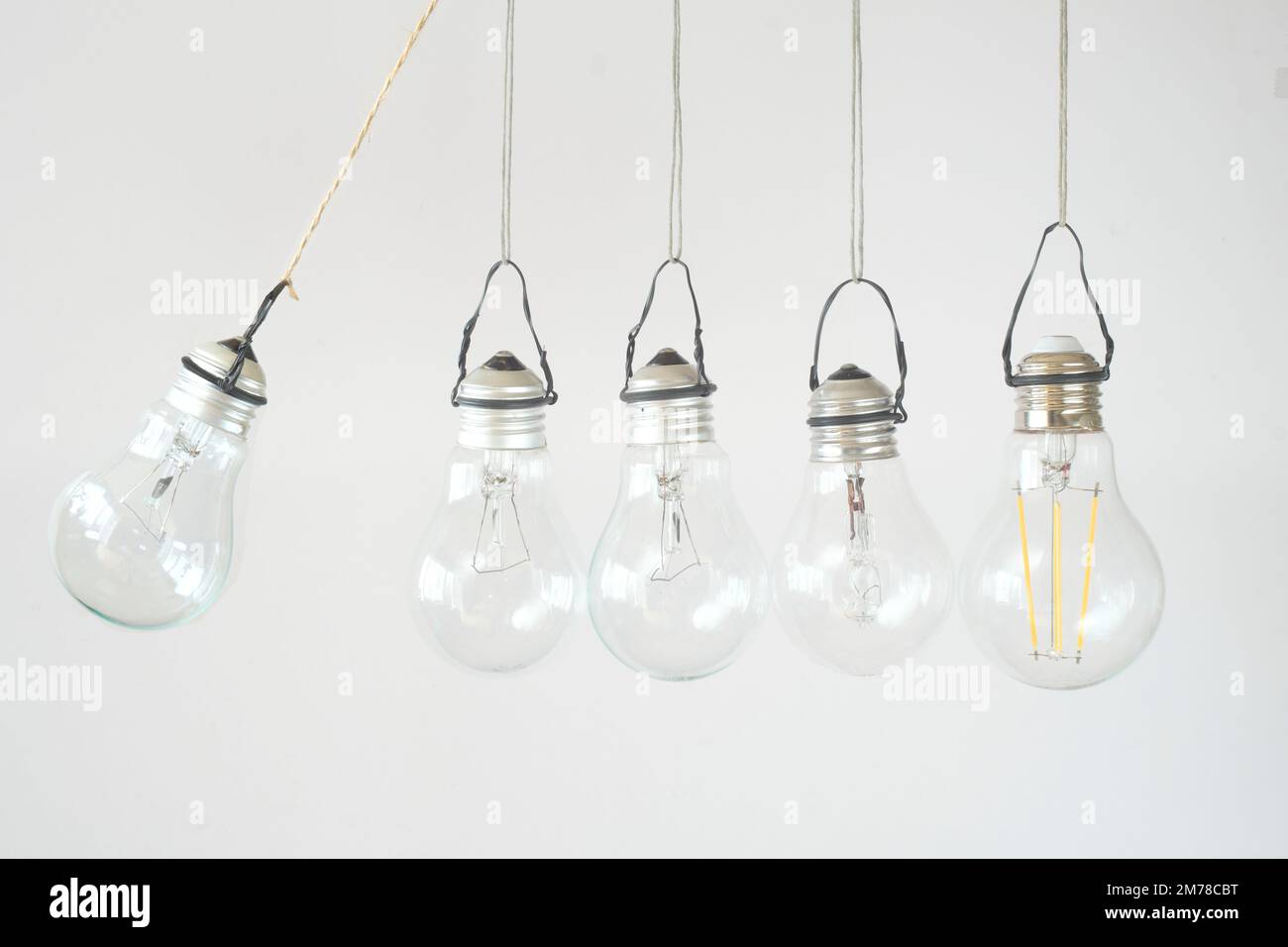 Risk management business concept.Bouncing lightbulbs,careful strategy development and leadership concept Stock Photo