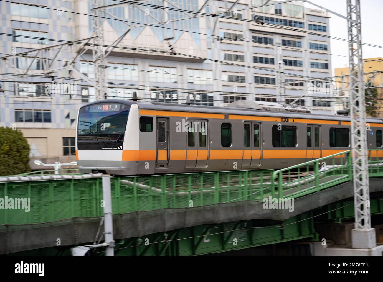 Tokyo, Japan. 6th Jan, 2023. A Chuo Line Rapid train at JR Sudiobashi Station.The JR East Chuo Line is a railway line in Japan operated by East Japan Railway Company (JR East). It runs from Tokyo Station in central Tokyo to Takao Station in the west, passing through major cities such as Yokohama, Hachioji, and Ome. The Chuo Line is colored orange on JR East train maps and is known for its rapid service, with trains reaching speeds of up to 130 km/h. It is used by commuters and tourists for travel to popular destinations such as Mount Takao, the Tama area, and the Fuji Five Lakes region. Th Stock Photo