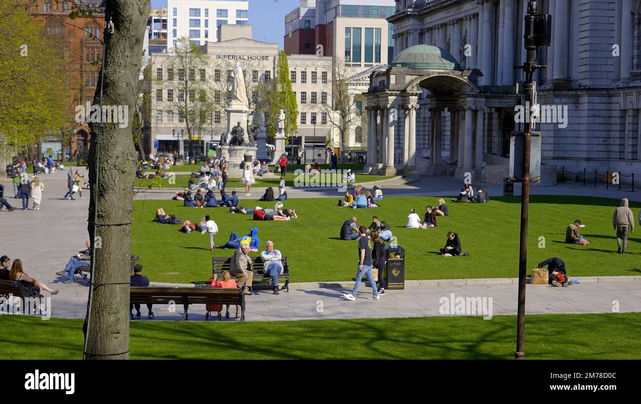 The green meadows at Belfast city hall are a great place to relax - BELFAST, UK - APRIL 25, 2022 Stock Photo