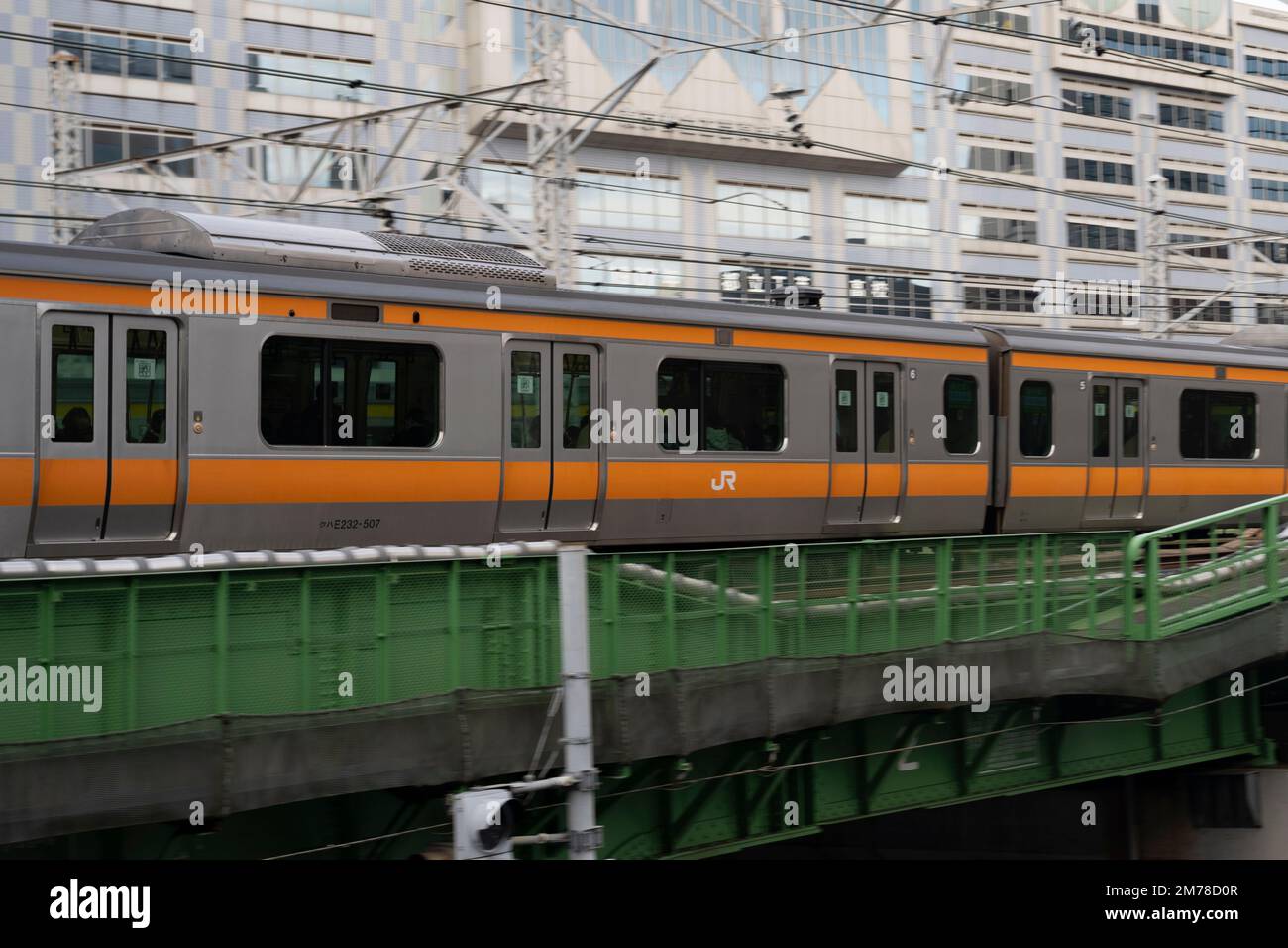 Tokyo, Japan. 6th Jan, 2023. A Chuo Line Rapid train at JR Sudiobashi Station.The JR East Chuo Line is a railway line in Japan operated by East Japan Railway Company (JR East). It runs from Tokyo Station in central Tokyo to Takao Station in the west, passing through major cities such as Yokohama, Hachioji, and Ome. The Chuo Line is colored orange on JR East train maps and is known for its rapid service, with trains reaching speeds of up to 130 km/h. It is used by commuters and tourists for travel to popular destinations such as Mount Takao, the Tama area, and the Fuji Five Lakes region. Th Stock Photo