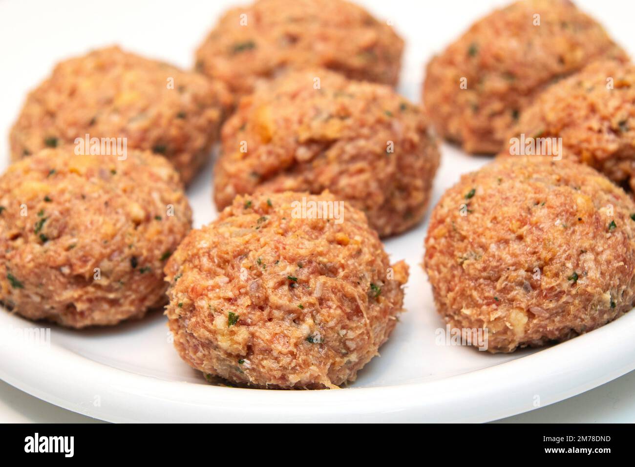 Raw meatballs on a white background Stock Photo