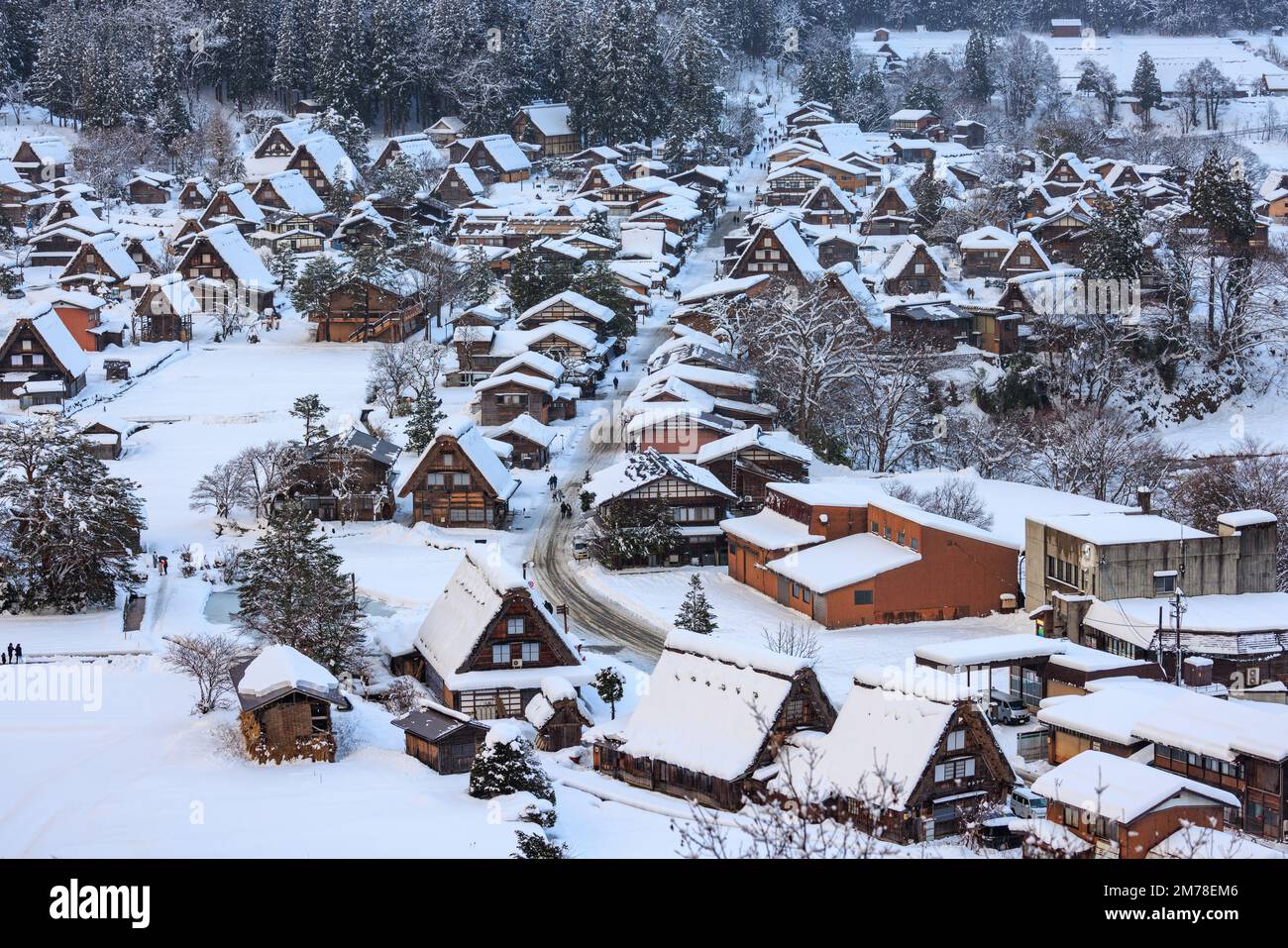 Snow covered A-frame roofs in Shirakawa-go on winter day Stock Photo