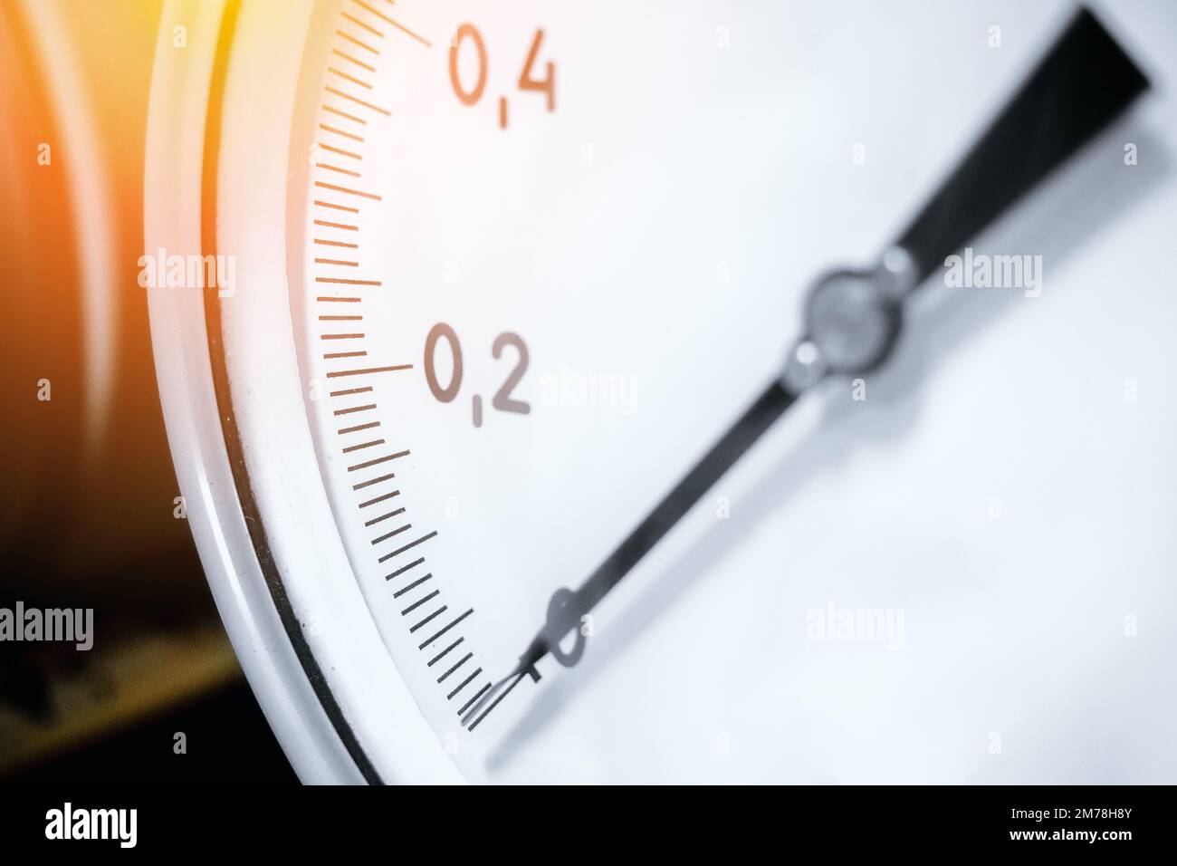 Pressure gauge closeup. Arrow of pressure gauge shows zero on scale
