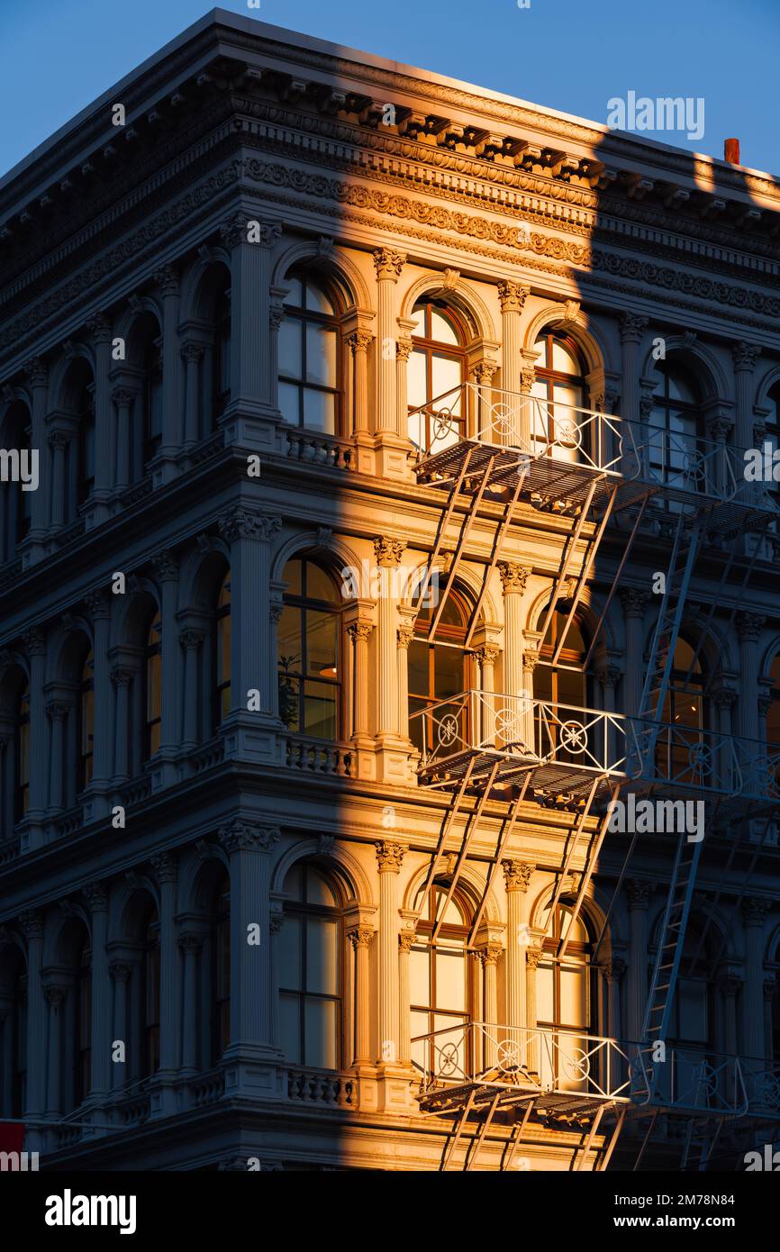 Soho loft building with facade ornamentation and fire escape. Soho Cast Iron Building Historic District, Lower Manhattan, New York City Stock Photo