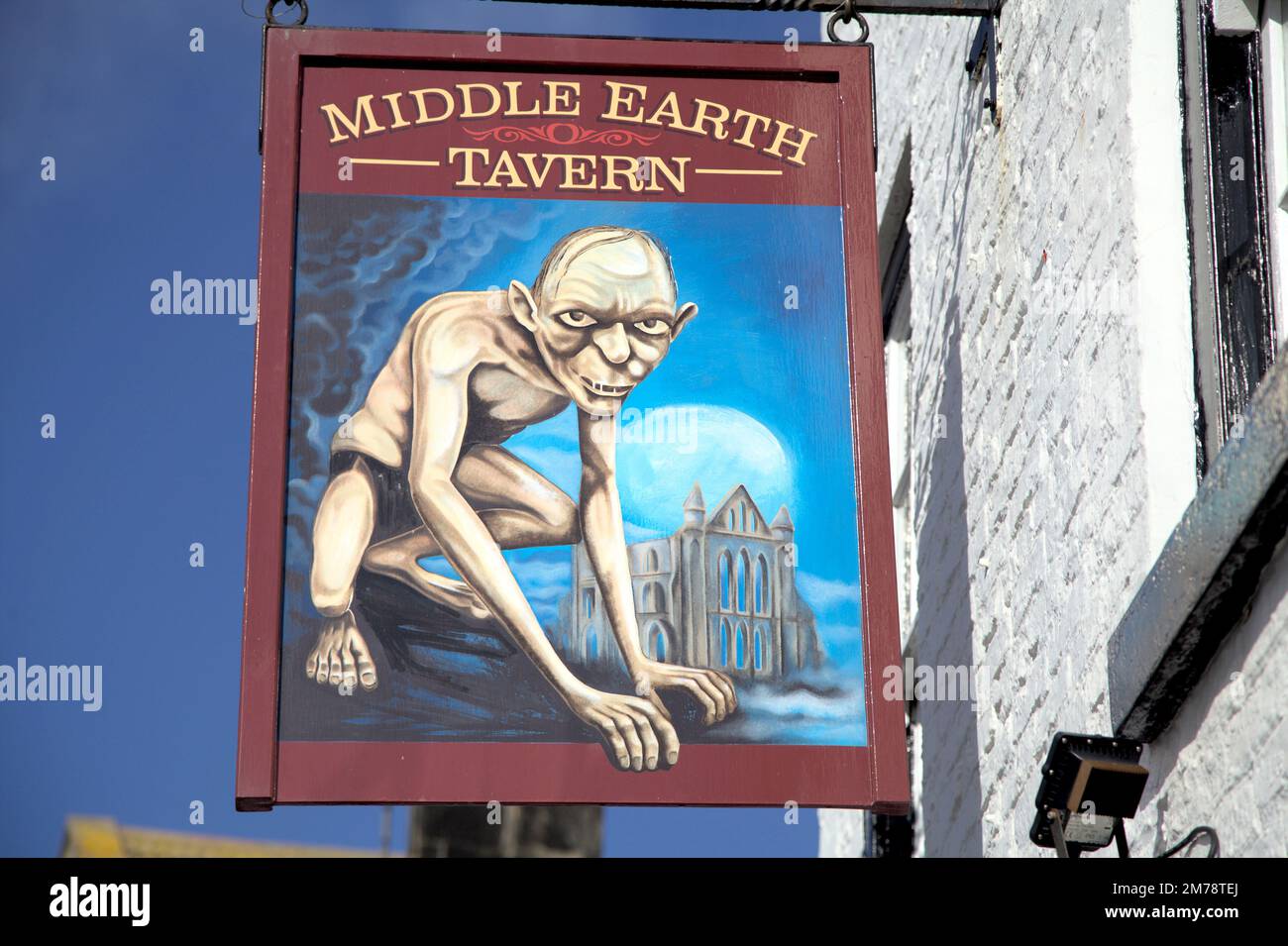 A closeup shot of the sign of a Middle Earth pub in Whitby featuring Gollum Stock Photo