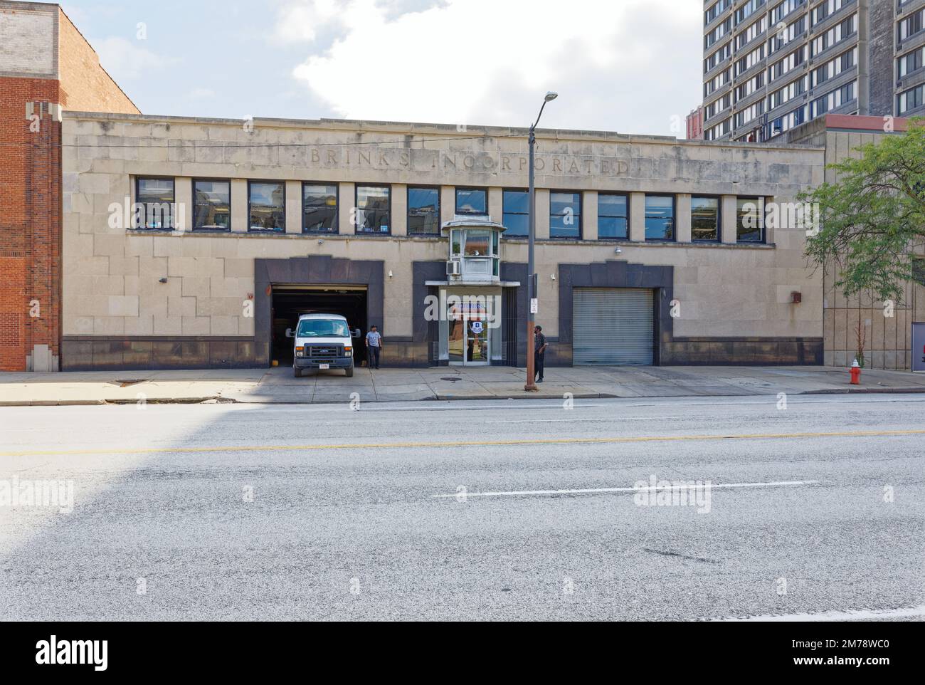 Brink’s Incorporated – the armored truck folks – garage on Superior Avenue. Note the guard post above the front door, between the loading docks. Stock Photo