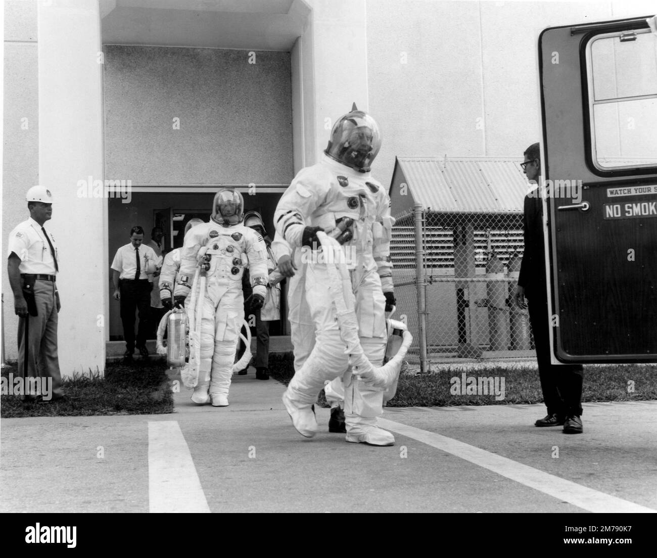 Cape Canaveral, United States. 11 October, 1968. NASA Apollo VII prime crew astronauts walk out of the Manned Spacecraft Operations Building on launch day at the Kennedy Space Center, October 11, 1968 in Cape Canaveral, Florida. Astronaut Walter Cunningham, center, died January 4, 2023 at 90-years-old, the last surviving member of the NASA Apollo 7 mission. Stock Photo