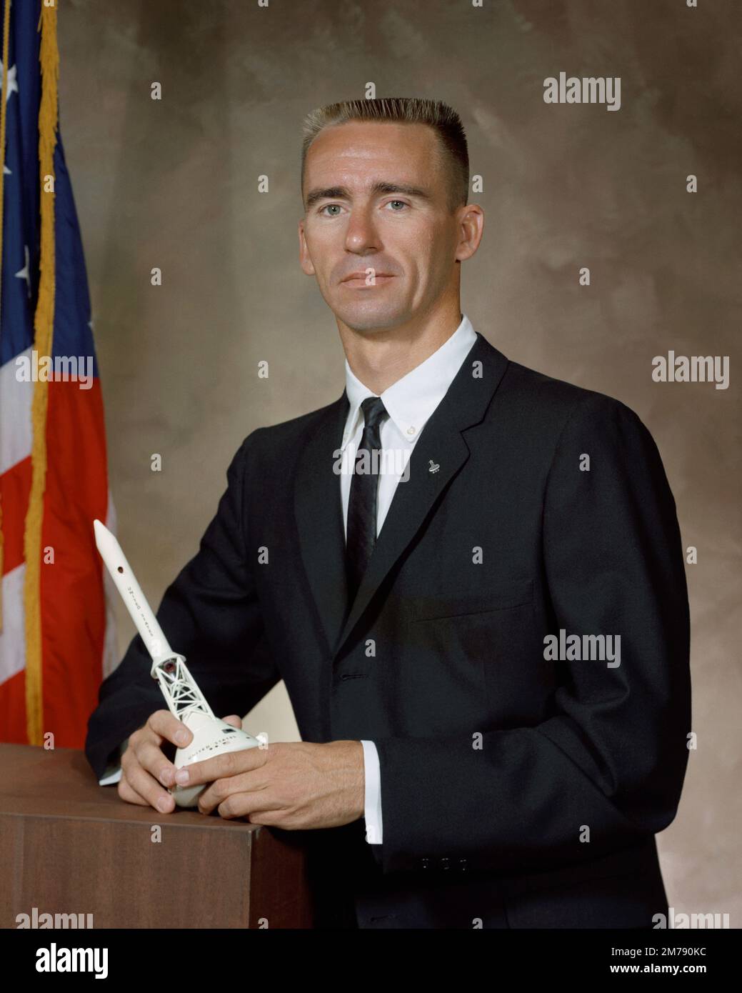 Houston, United States. 10 September, 1964. NASA astronaut Walter Cunningham, lunar module pilot for the Apollo 7 mission poses with a model of the Apollo 7 Saturn rocket ship at the Manned Spacecraft Center,  September 10, 1964 in Houston, Texas. Cunningham died January 4, 2023 at 90-years-old, the last surviving member of the NASA Apollo 7 mission. Stock Photo