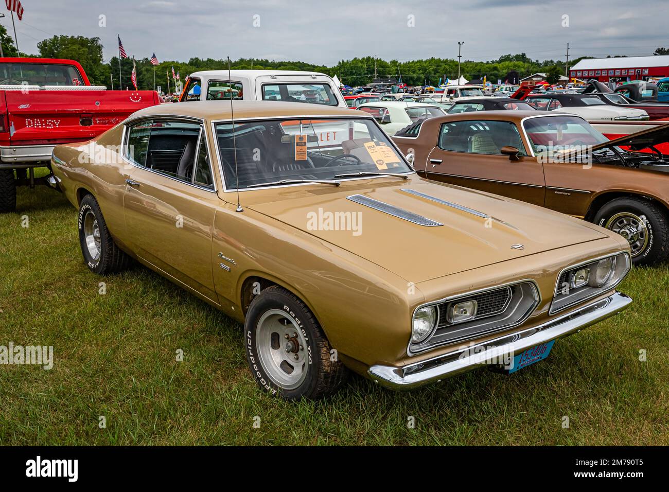 Iola, WI - July 07, 2022: High perspective front corner view of a 1967 Plymouth Barracuda Fastback at a local car show. Stock Photo
