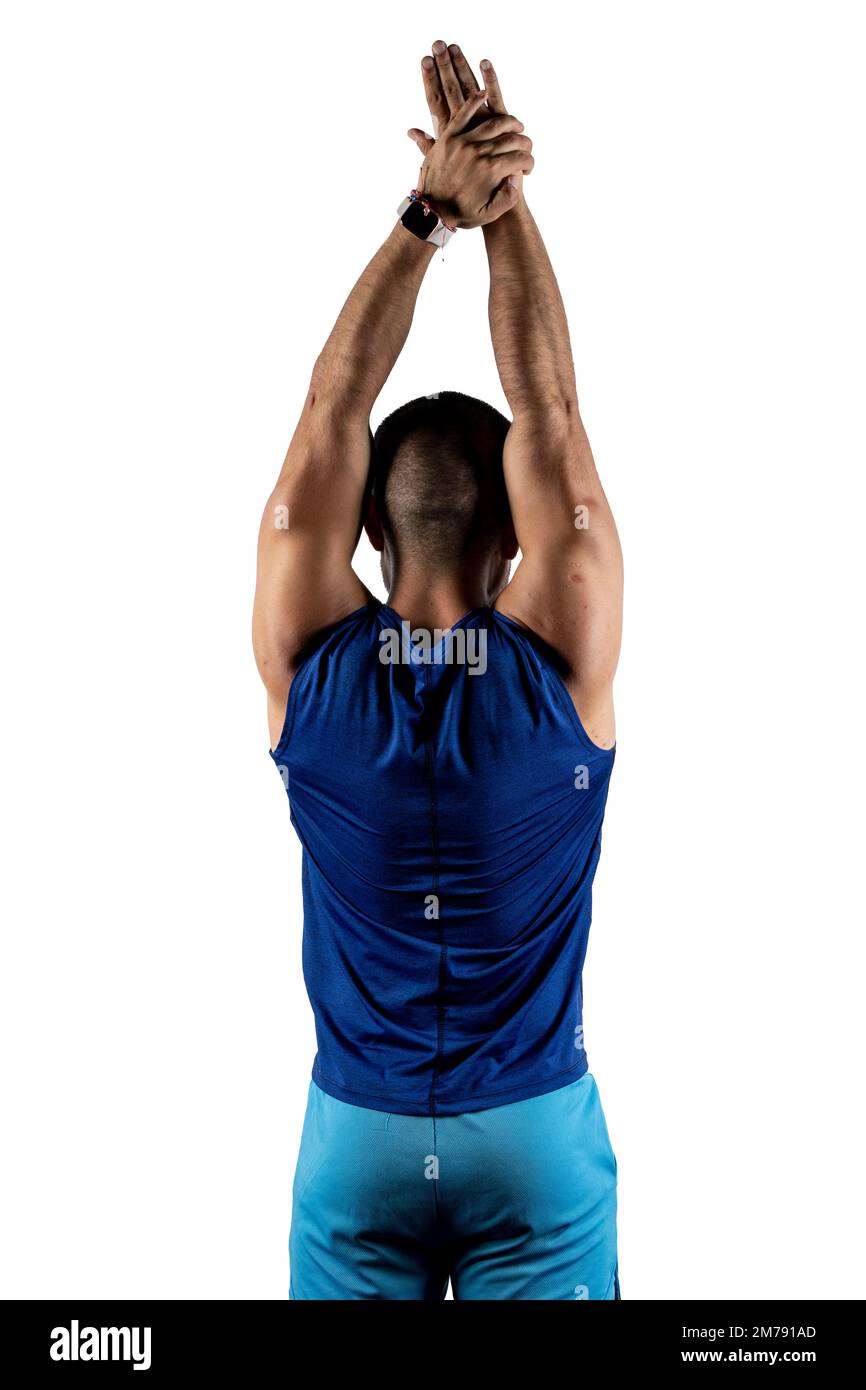 Portrait from behind of a Latino man in blue sportswear stretching his arms  Stock Photo - Alamy