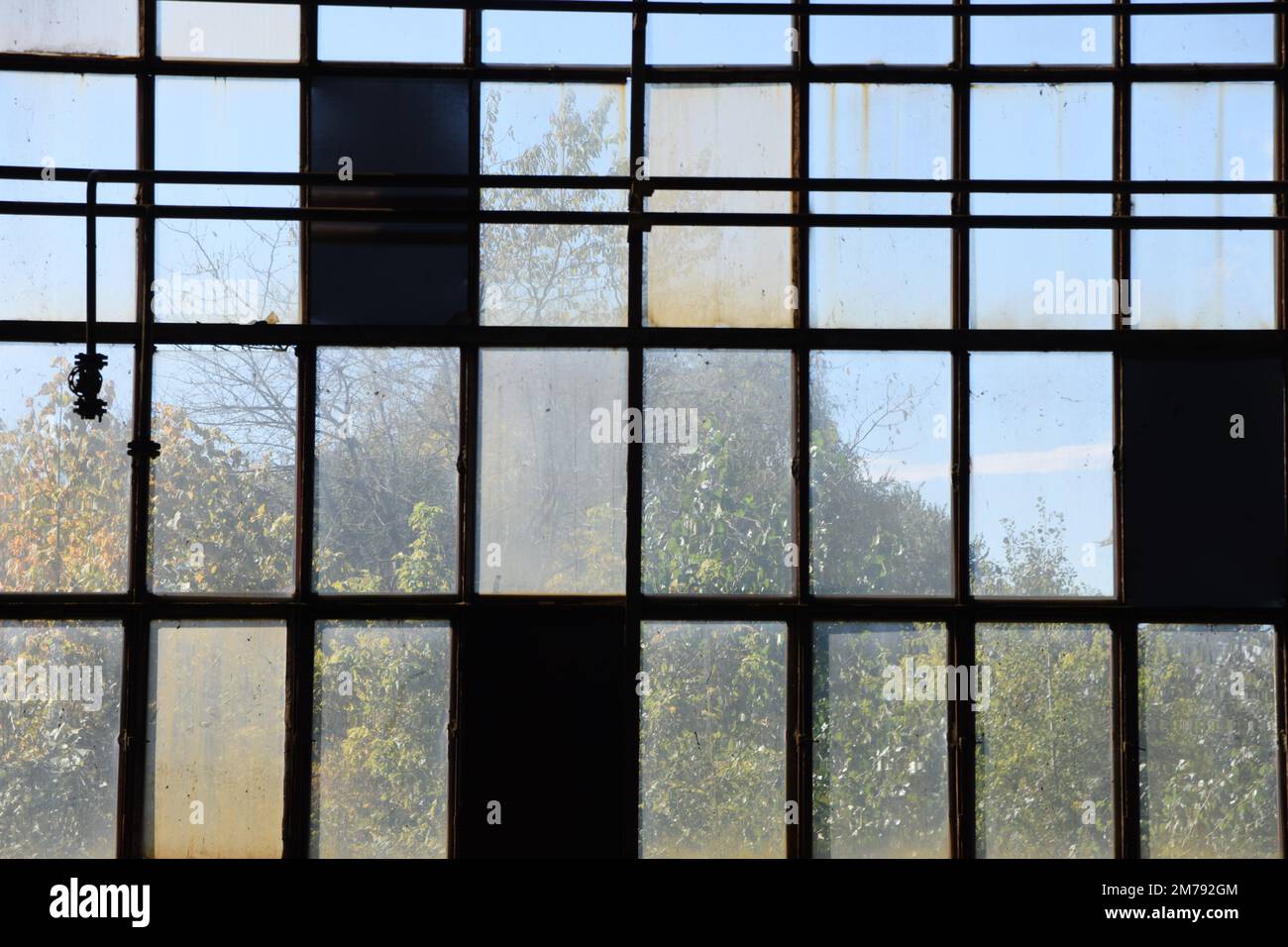 A grid with windows, some of them are closed Stock Photo