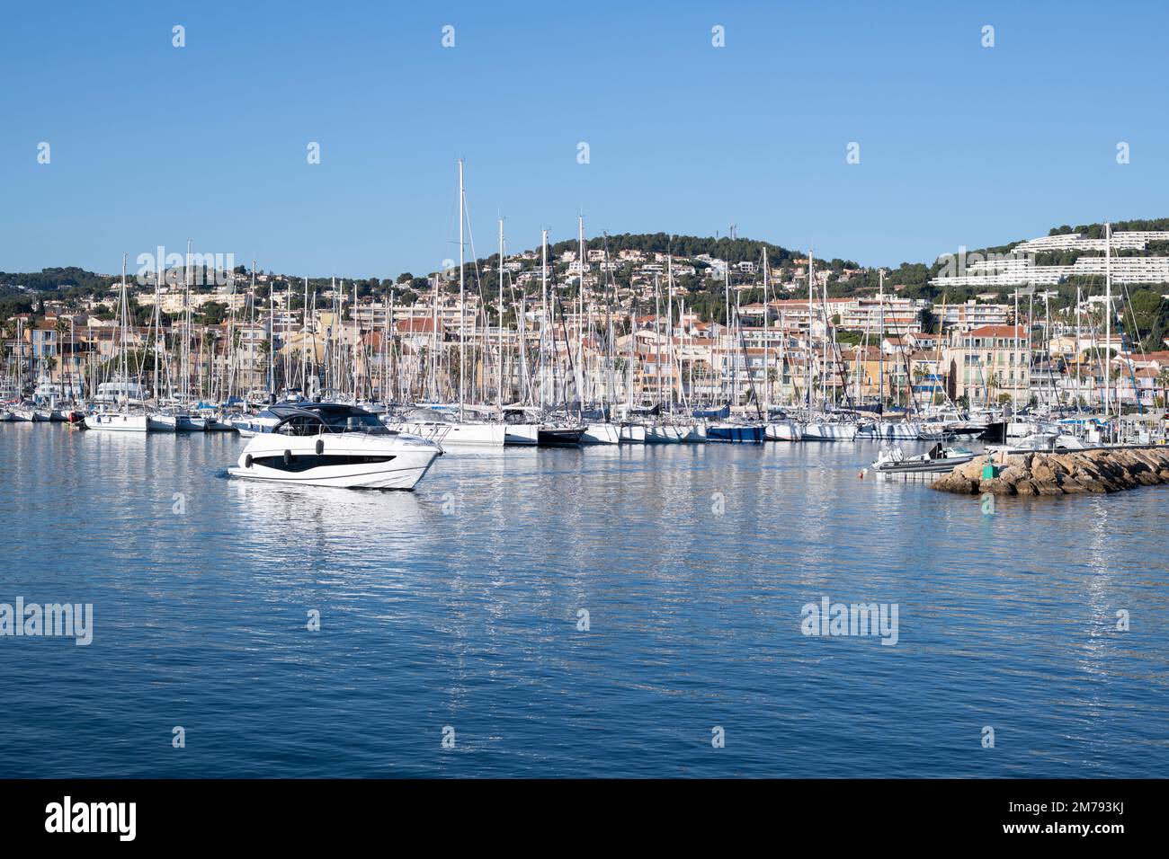 A boat leaving the Marina of Bandol with copy space, France, a travel destination Stock Photo