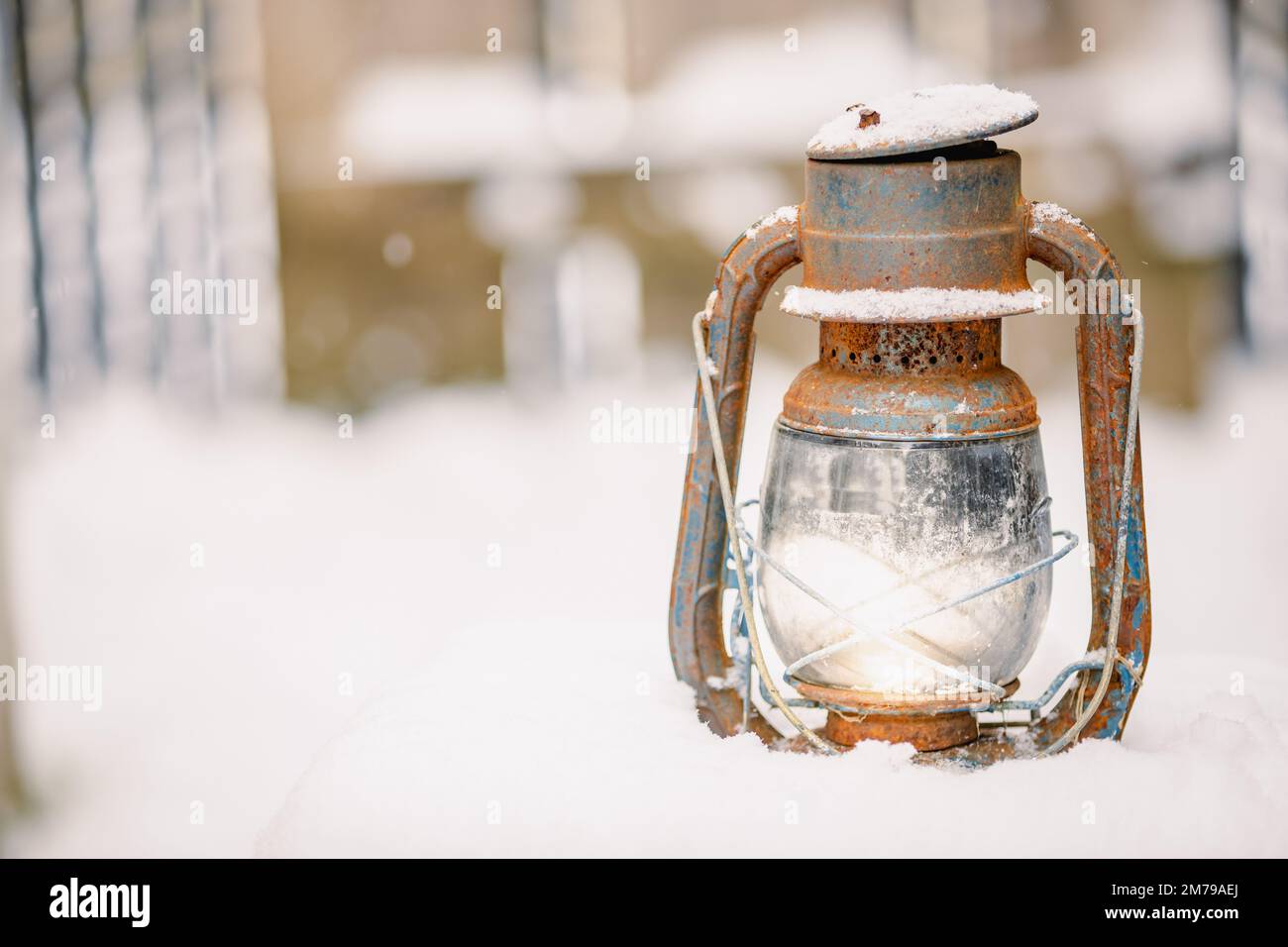 Old railroad lantern in the winter snow with room for copy Stock Photo