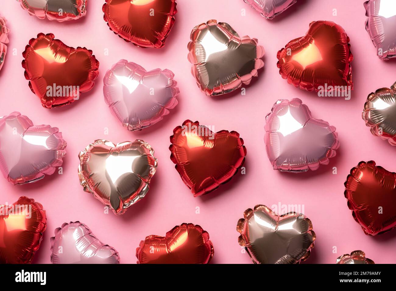Pink background with red hearts balloons Stock Photo - Alamy