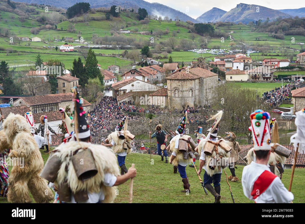 08 January 2023, Spain, Silió: Thousands of people from the church of the village watch the protagonists of the winter masquerade dance. The Vijanera, a kind of traditional carnival in northern Spain, is an ethnographic celebration that takes place at the winter solstice. Villagers dressed in natural costumes dance loudly to welcome the New Year and drive away evil spirits. Photo: Felipe Passolas/dpa Stock Photo