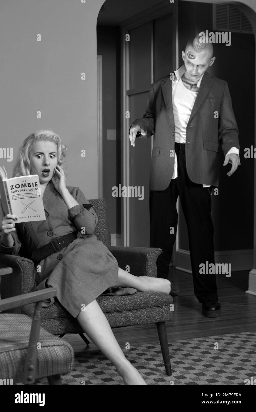 Blonde woman with zombie Stock Photo - Alamy