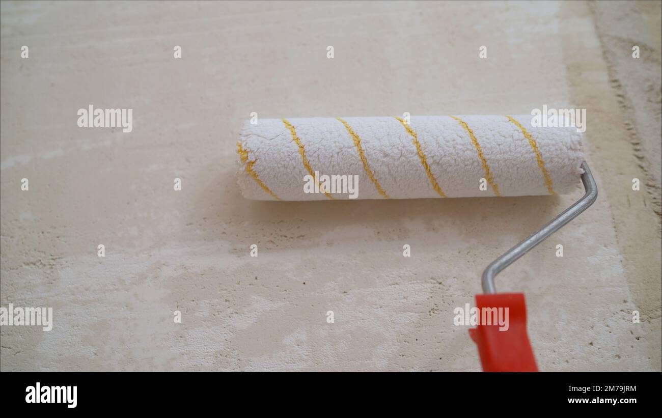 The solution is in a bucket. Preparation of a cement mixture for laying