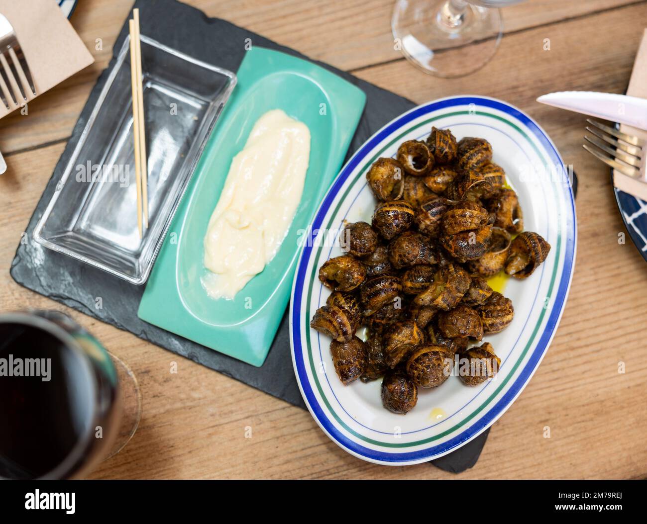 Dish of snails prepared at spanish style Stock Photo Alamy