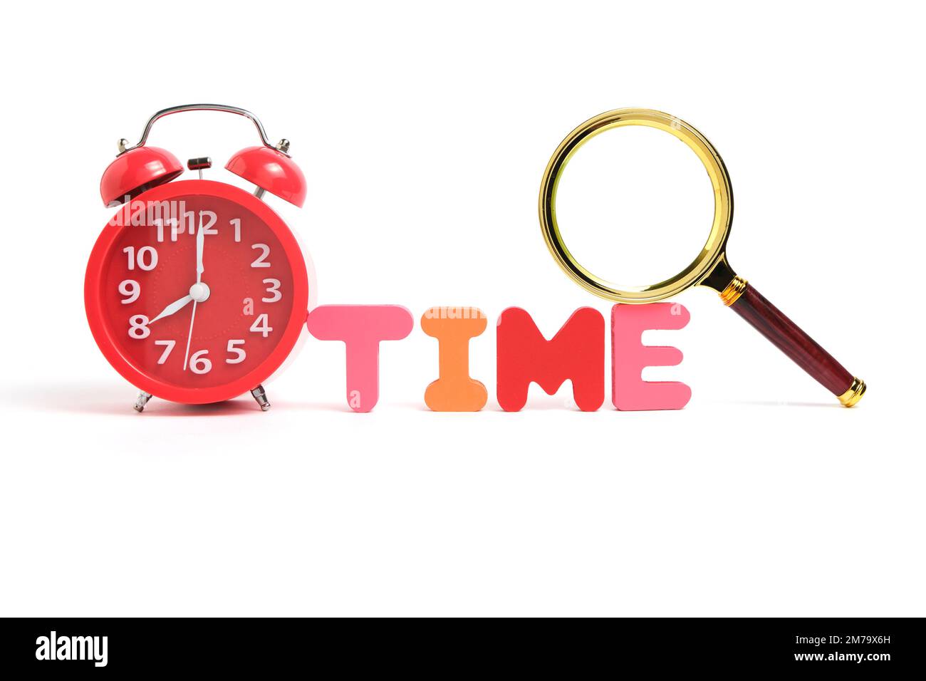 Red alarm clock showing eight morning and the word time consisting