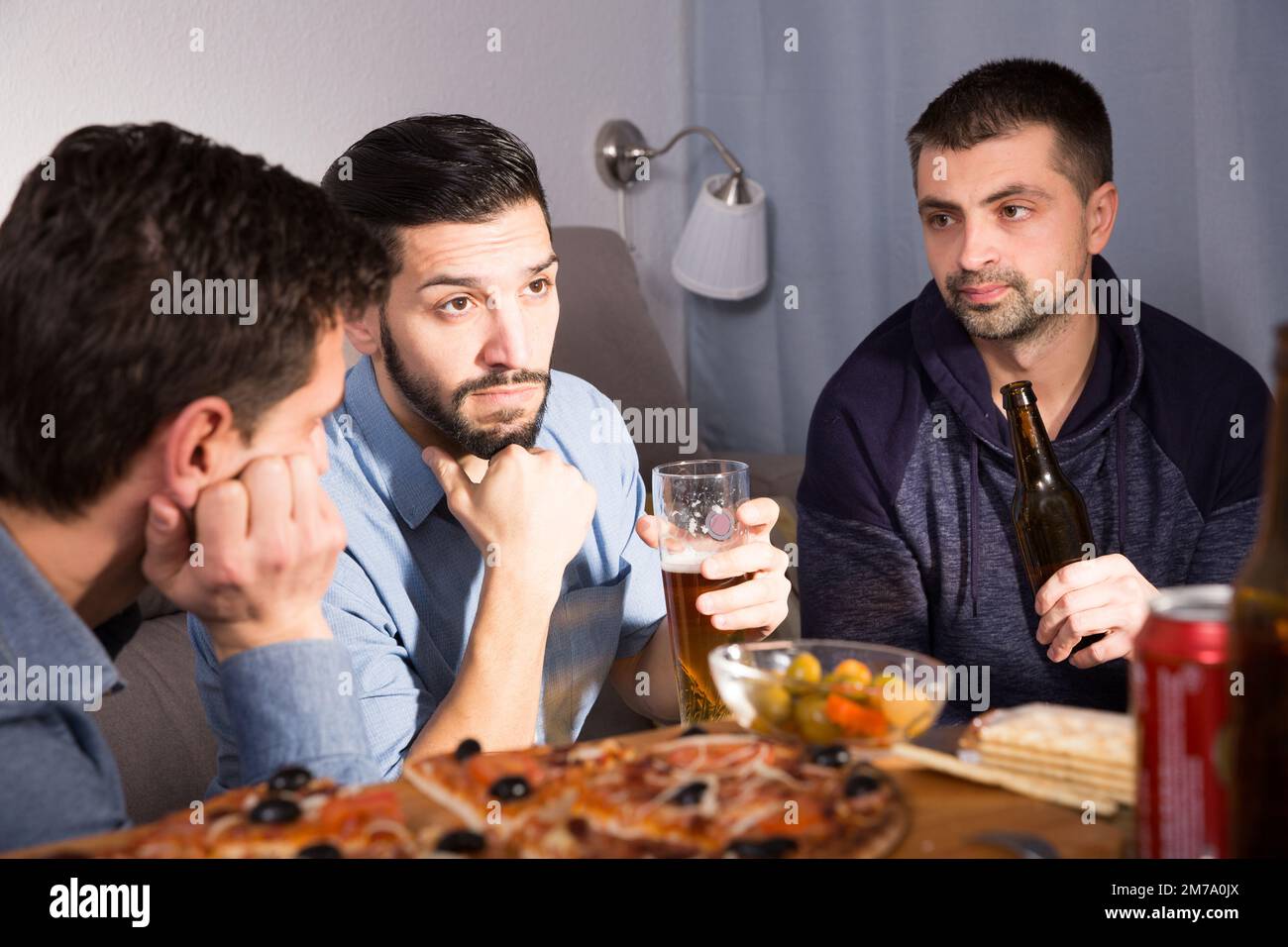 Three anxious men discussing problems Stock Photo - Alamy