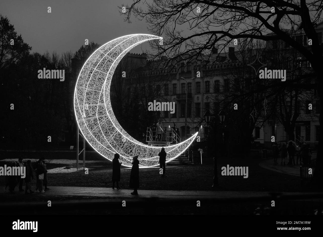 Riga, Latvia, January 1, 2023: Moon shape lighting installation in the city as New Year decoration Stock Photo