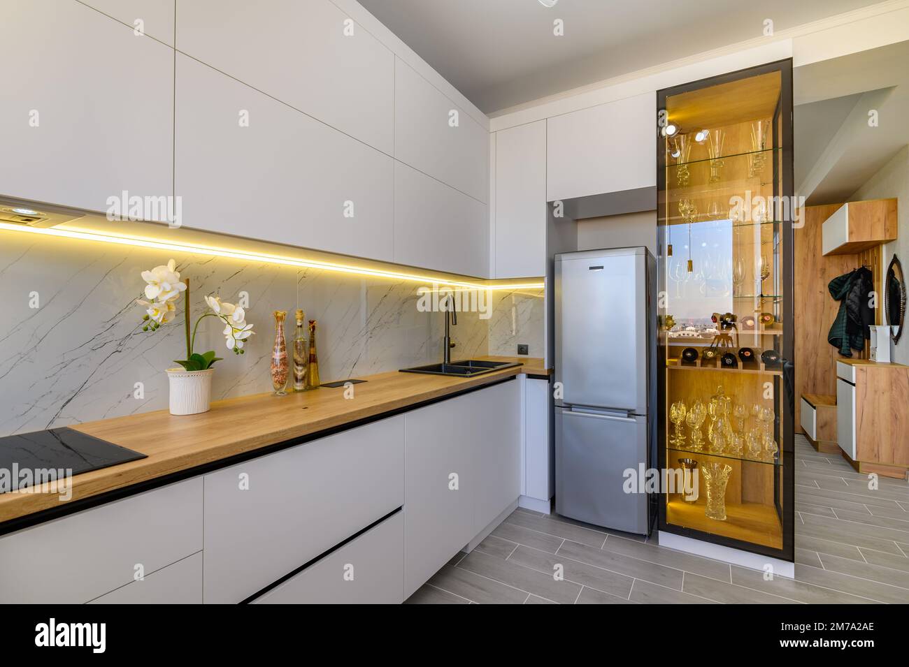 A modern white studio with a stylish kitchen Stock Photo
