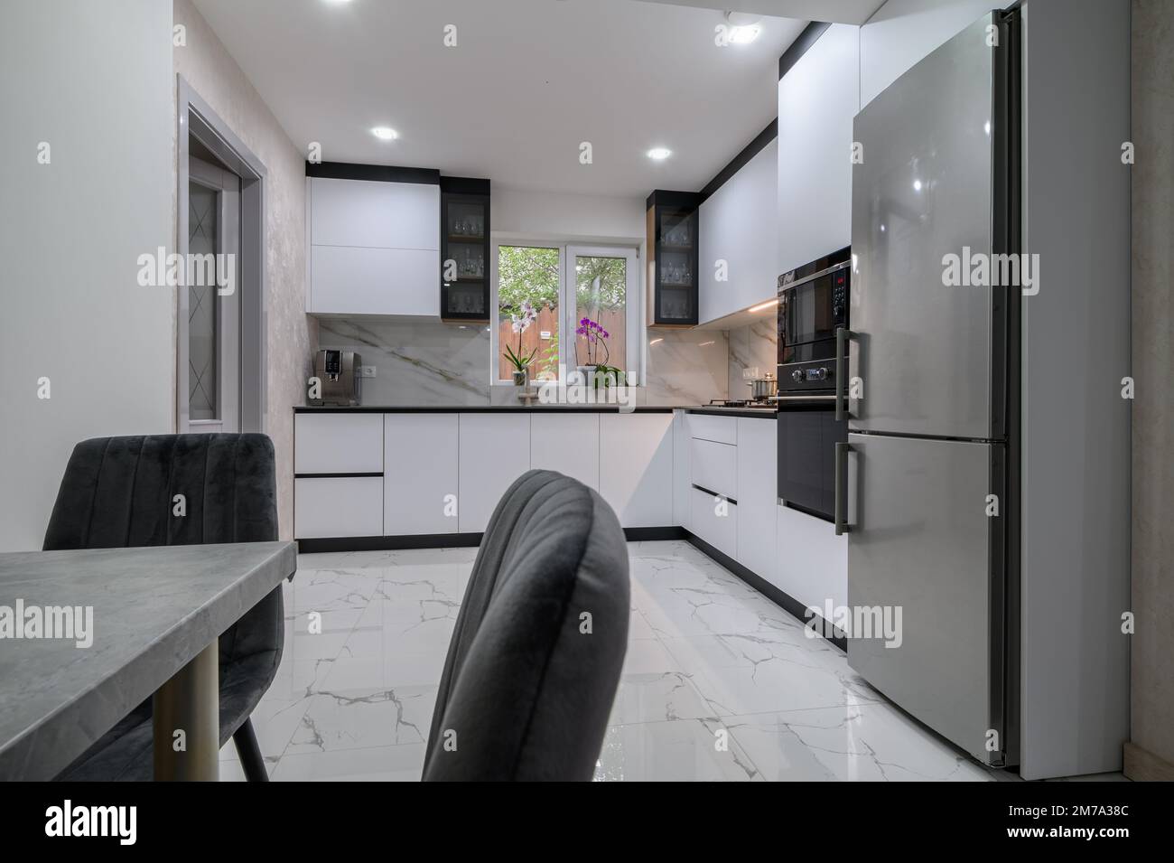 New large modern well designed white kitchen and dining room in studio ...