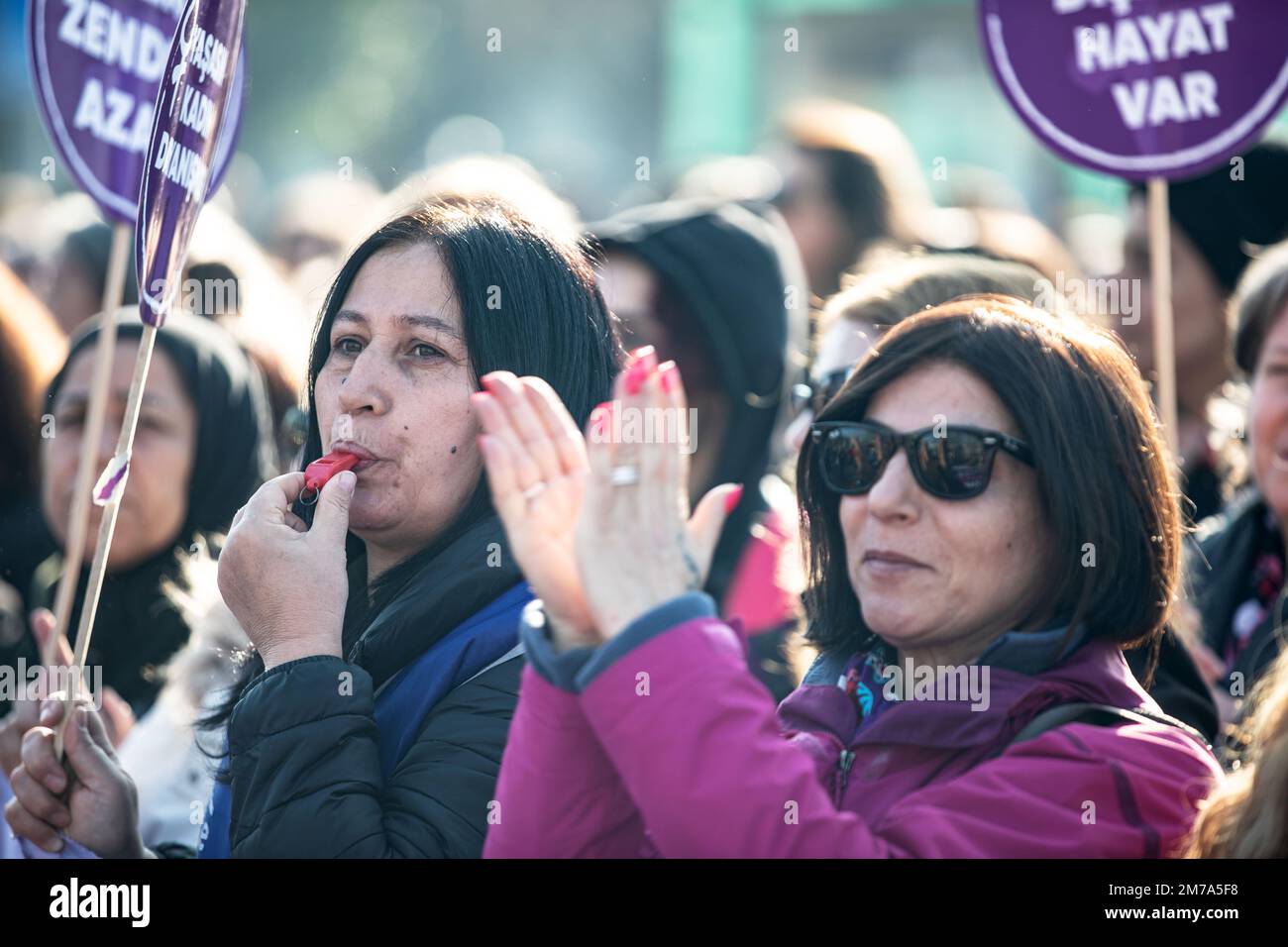 Istanbul, Turkey. 08th Jan, 2023. A demonstrator whistles and another applauds during a protest. The Women Strong Together platform gathered at the Kadikoy quay and held a demonstration on femicide, violence against women and all other problems experienced by women. (Photo by Onur Dogman/SOPA Images/Sipa USA) Credit: Sipa USA/Alamy Live News Stock Photo