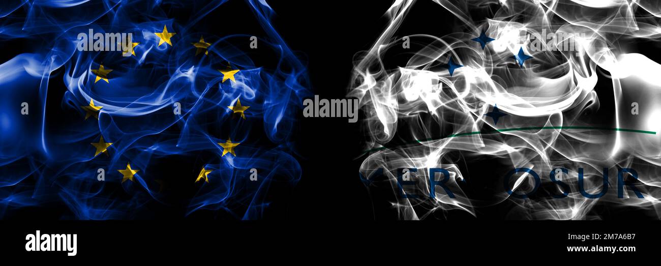 Flags of EU, European Union vs Organizations, Mercosur. Smoke flag placed side by side on black background. Stock Photo