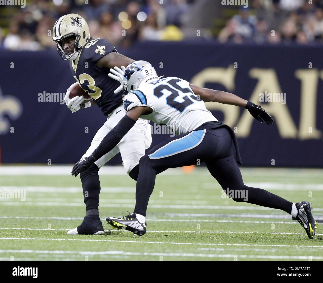 New Orleans, United States. 8th Jan, 2023. New Orleans Saints tight end Juwan Johnson (83) avoids Carolina Panthers safety Xavier Woods (25) at the Caesars Superdome in New Orleans on Sunday, January 8, 2023. Photo by AJ Sisco/UPI. Credit: UPI/Alamy Live News Stock Photo