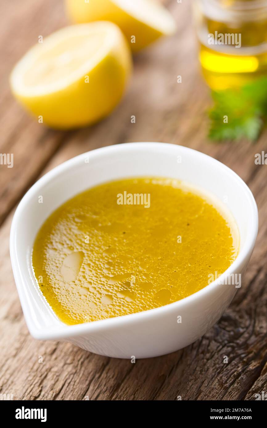 Fresh homemade vinaigrette salad dressing made of olive oil, lemon
