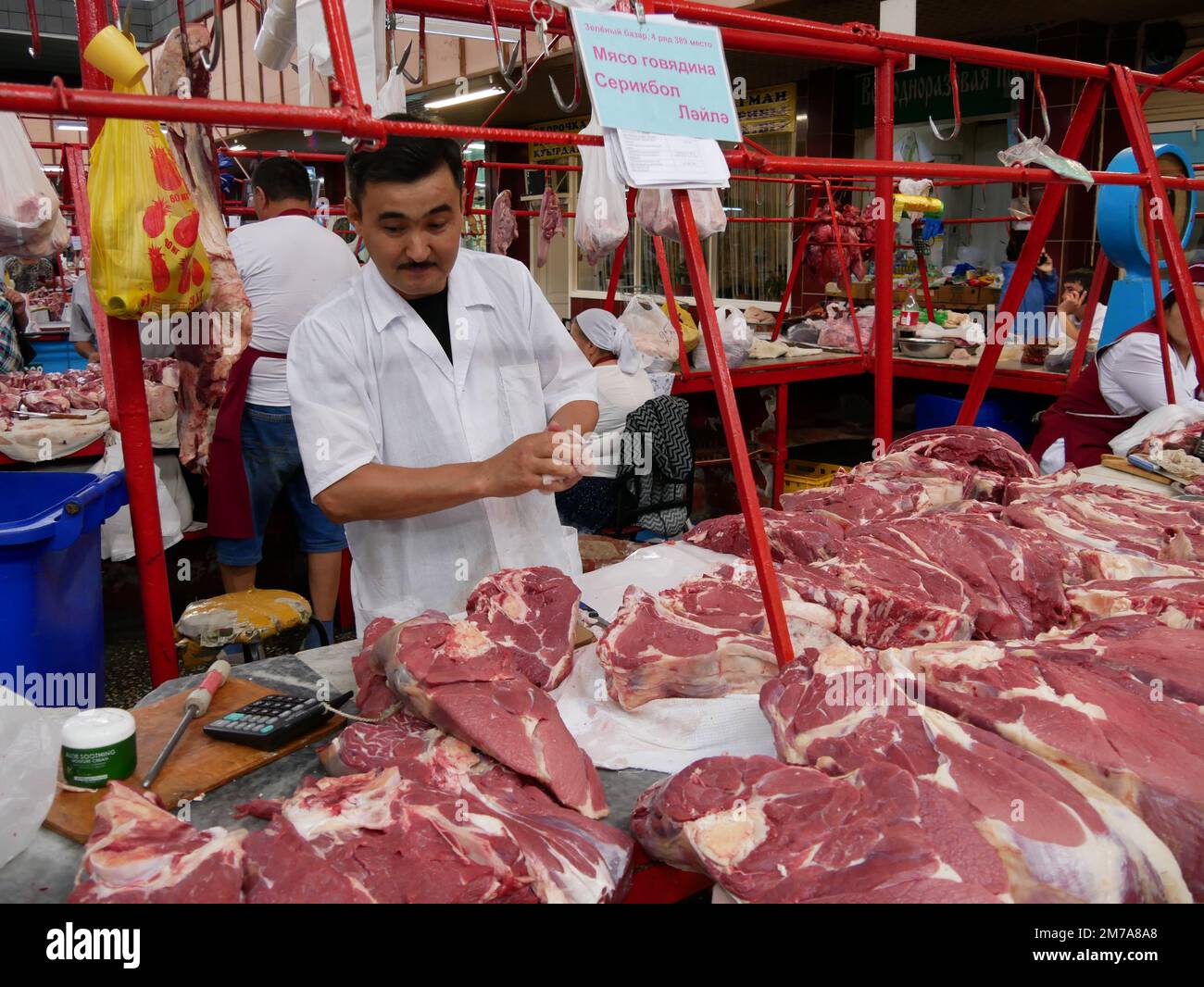 A butcher's stall with fresh meat of various sorts at the Green Bazaar of Almaty in Kazakhstan Stock Photo