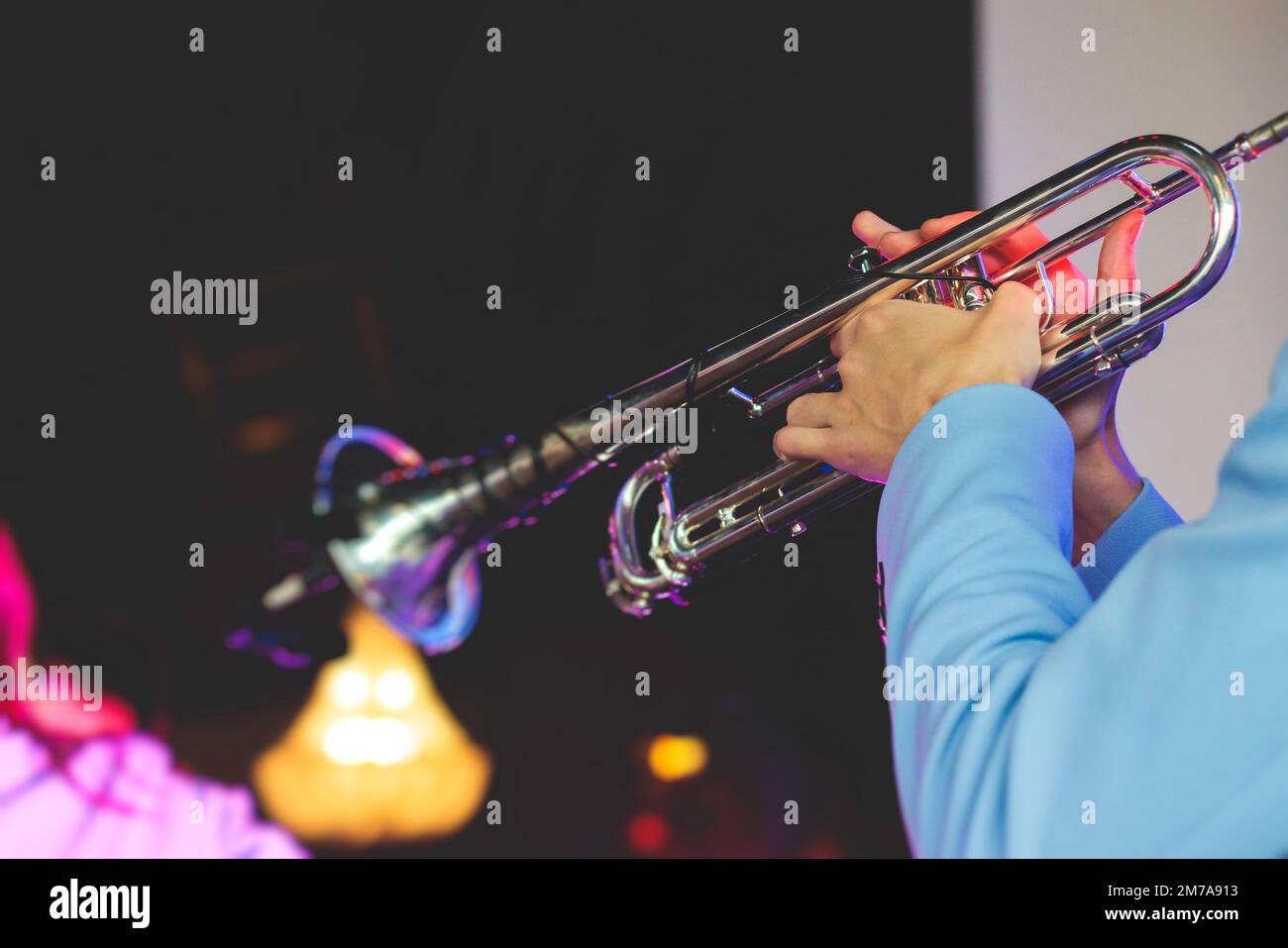 Concert view of a male trumpeter, professional trumpet player with