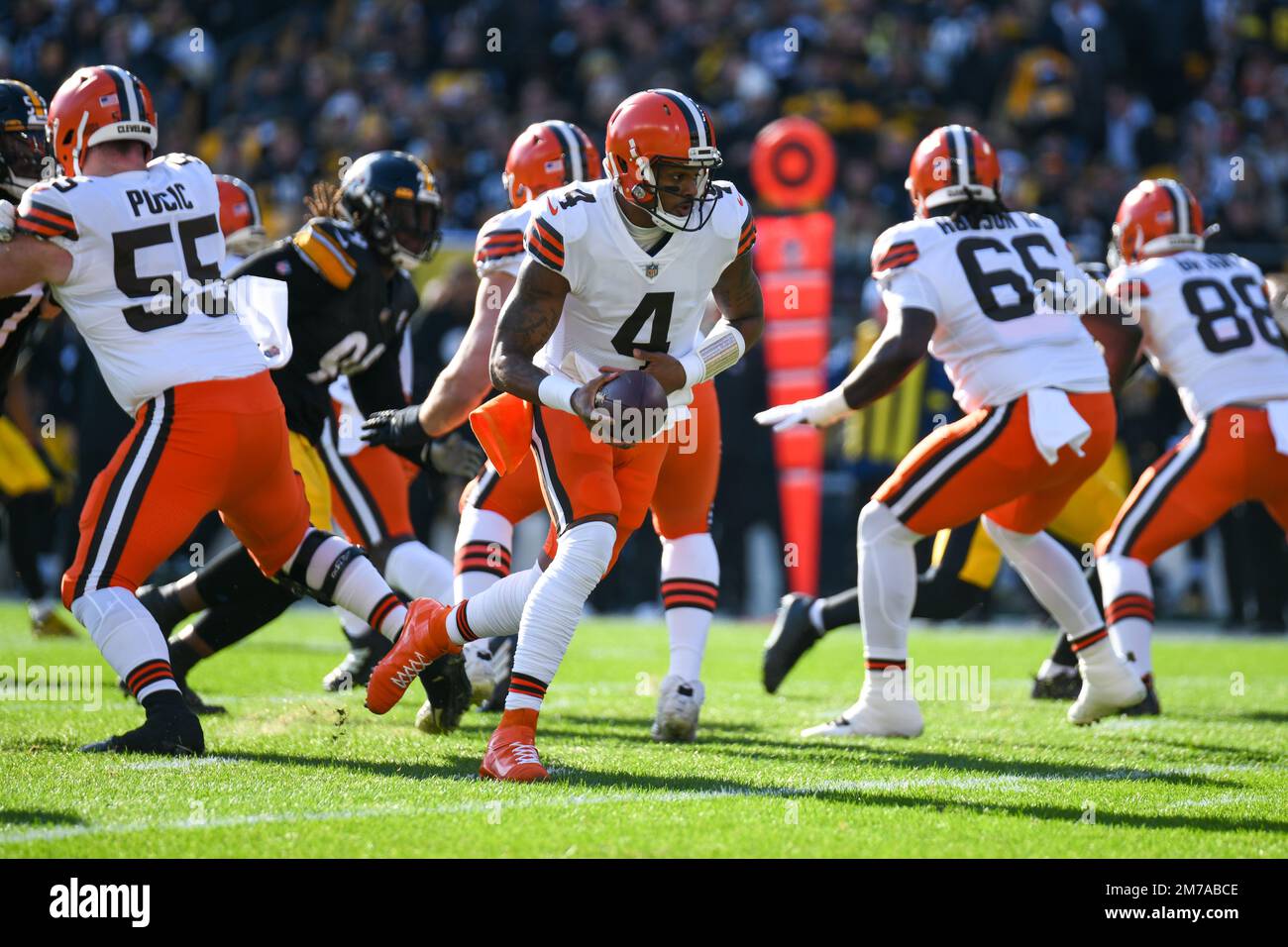 Cincinnati, United States. 11th Dec, 2022. Cleveland Browns quarterback  Deshaun Watson (4) fights to break free from Cincinnati Bengals Sam Hubbard  (84) during the first half of play at Paycor Stadium on