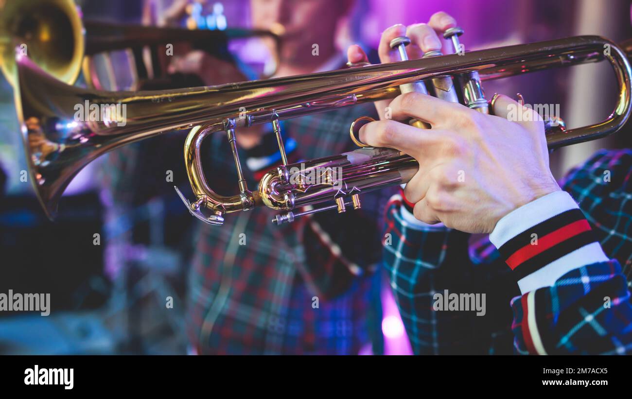 Concert view of a male trumpeter, professional trumpet player with