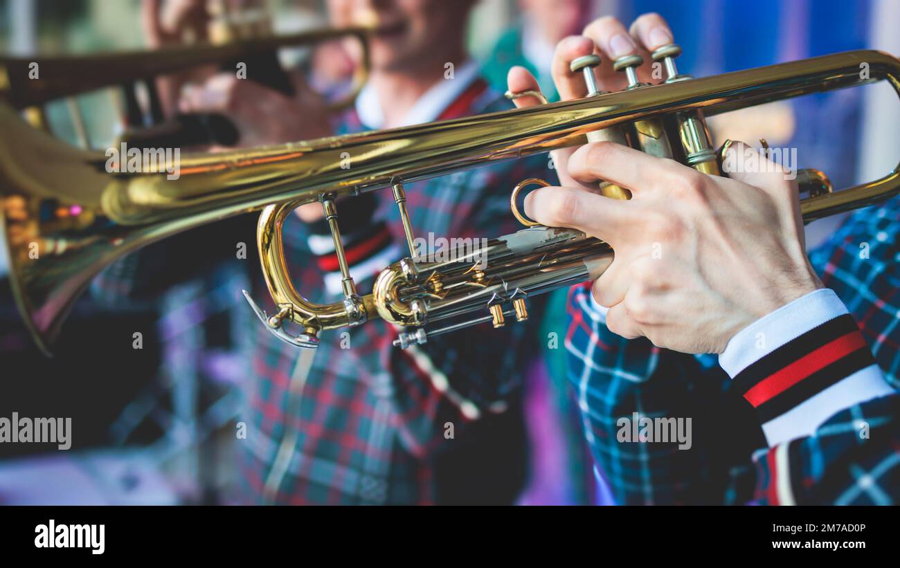 Concert view of a male trumpeter, professional trumpet player with