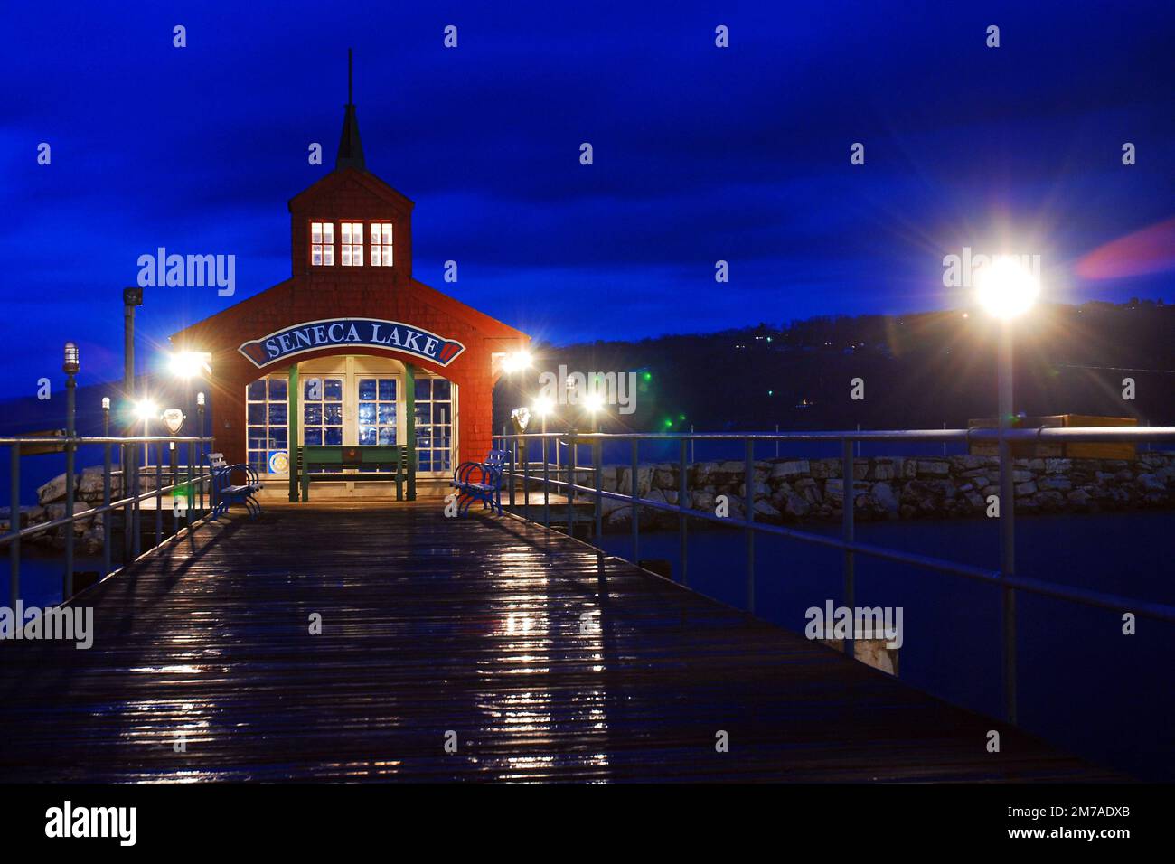 A small boathouse stands at the end of the pier in Watkins Glen, New York Stock Photo