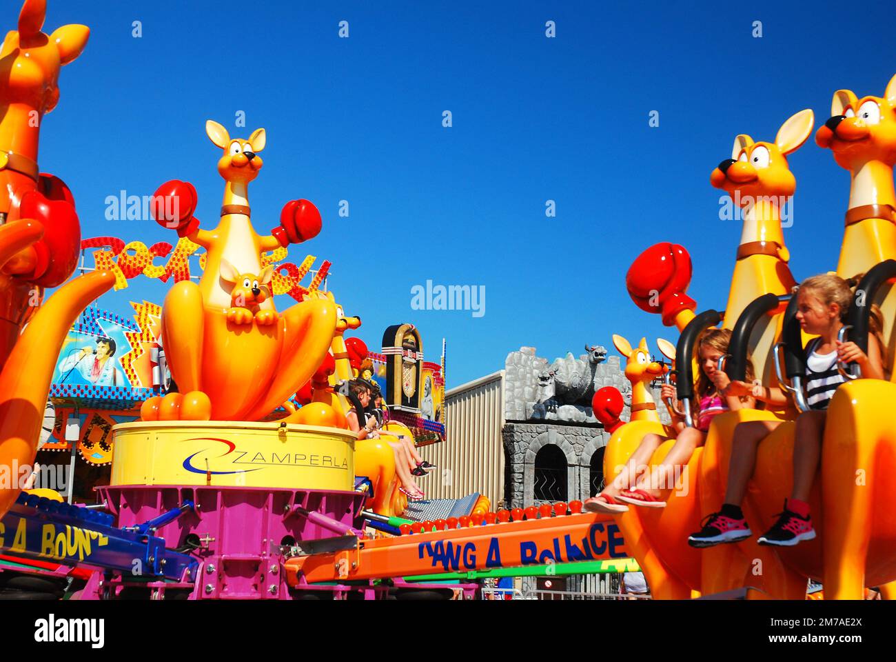 Kid Riding Kangaroo A kangaroo themed ride gives children a mild thrill as it goes around ...