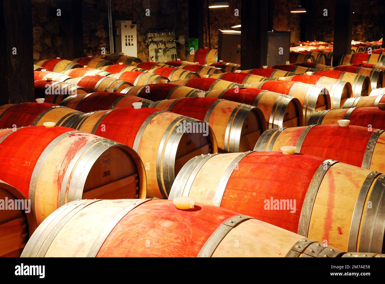 Wine ages in oak barrels in a basement in the Napa Valley Stock Photo Alamy