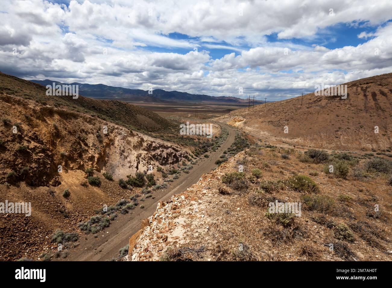 The abandoned roadbed of Highway US 40 descends towards Golcanda, Nevada, from the Golcanda Summit. Stock Photo