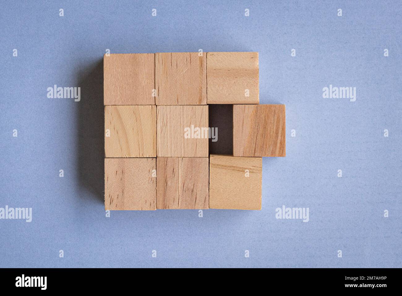 Problem Solving Building Blocks Wooden blocks on blue background, top view. Team work and problem ...