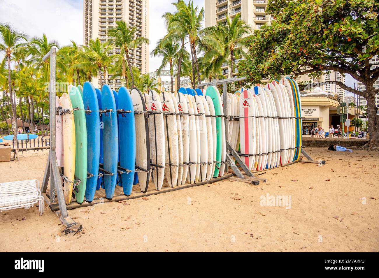 Honolulu, Hawaii January 1, 2023 Surfboards lined up for rent in